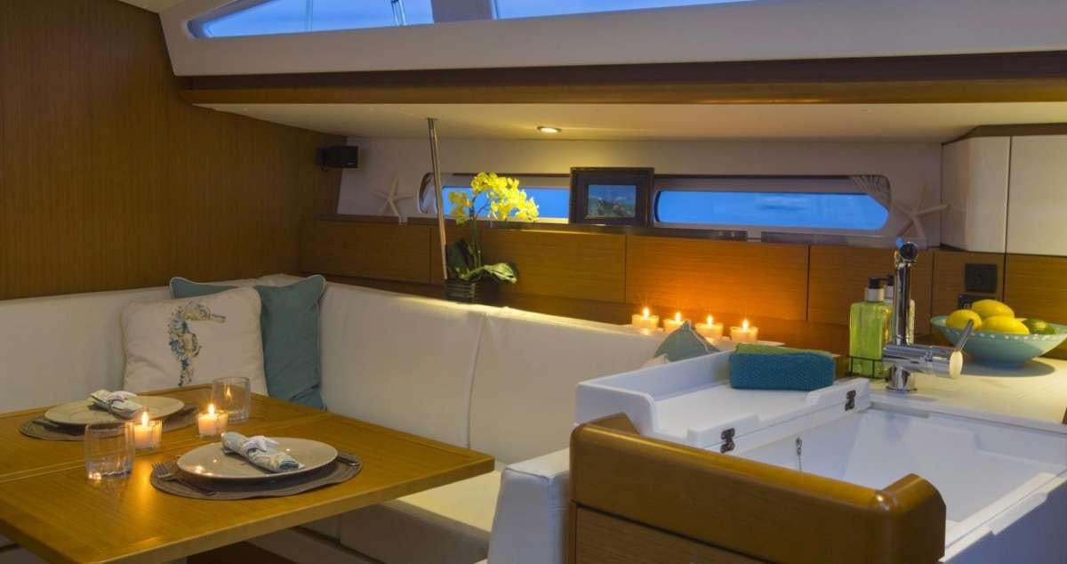 a room with a table and couches aboard Sea Wolf Yacht for Charter