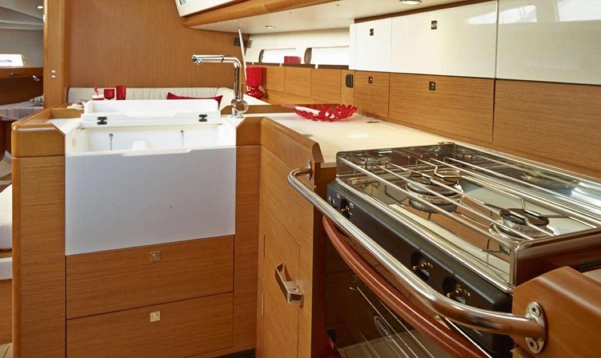 a kitchen with a stove and sink aboard Sea Wolf Yacht for Charter