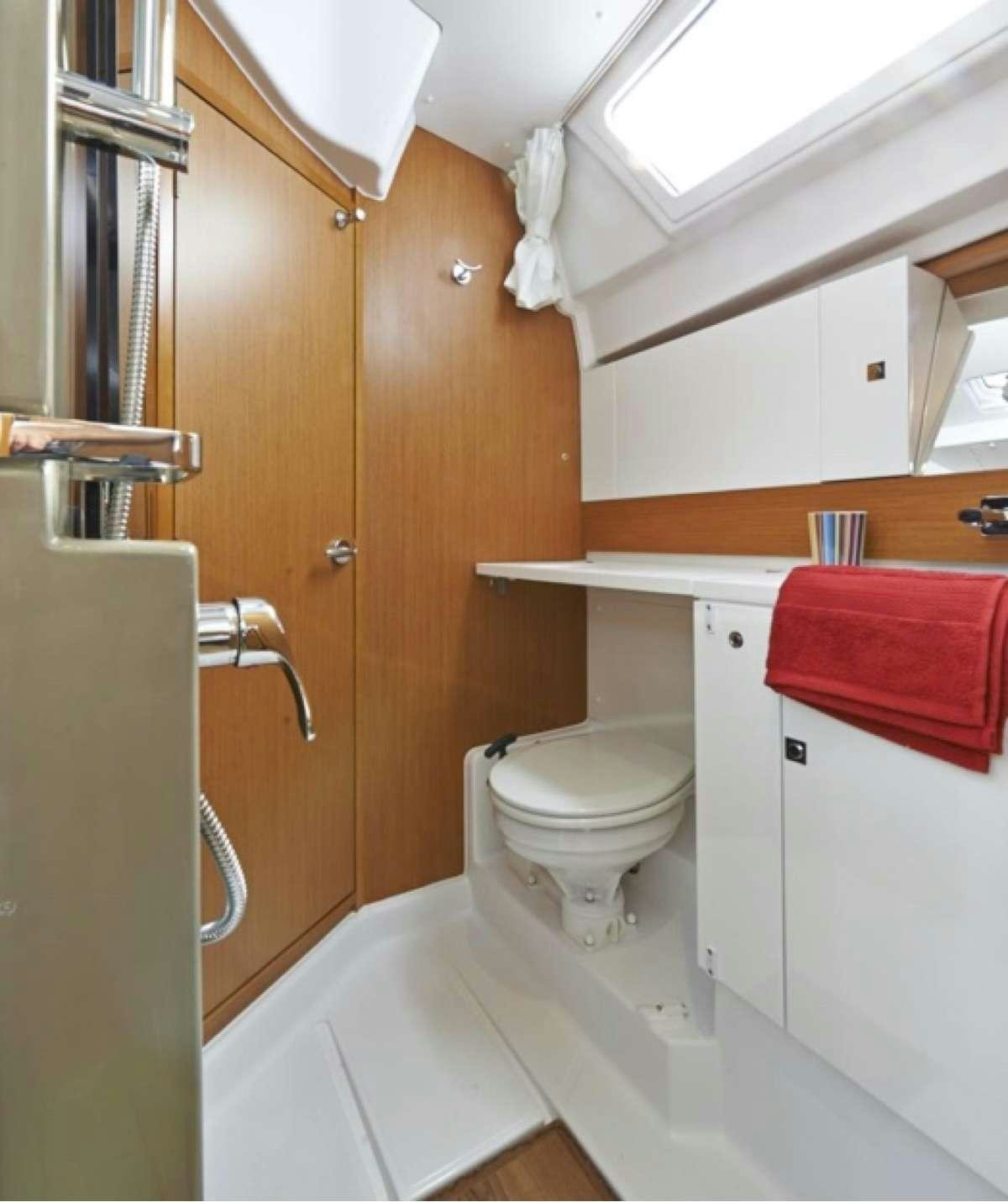a bathroom with a toilet and sink aboard Sea Wolf Yacht for Charter