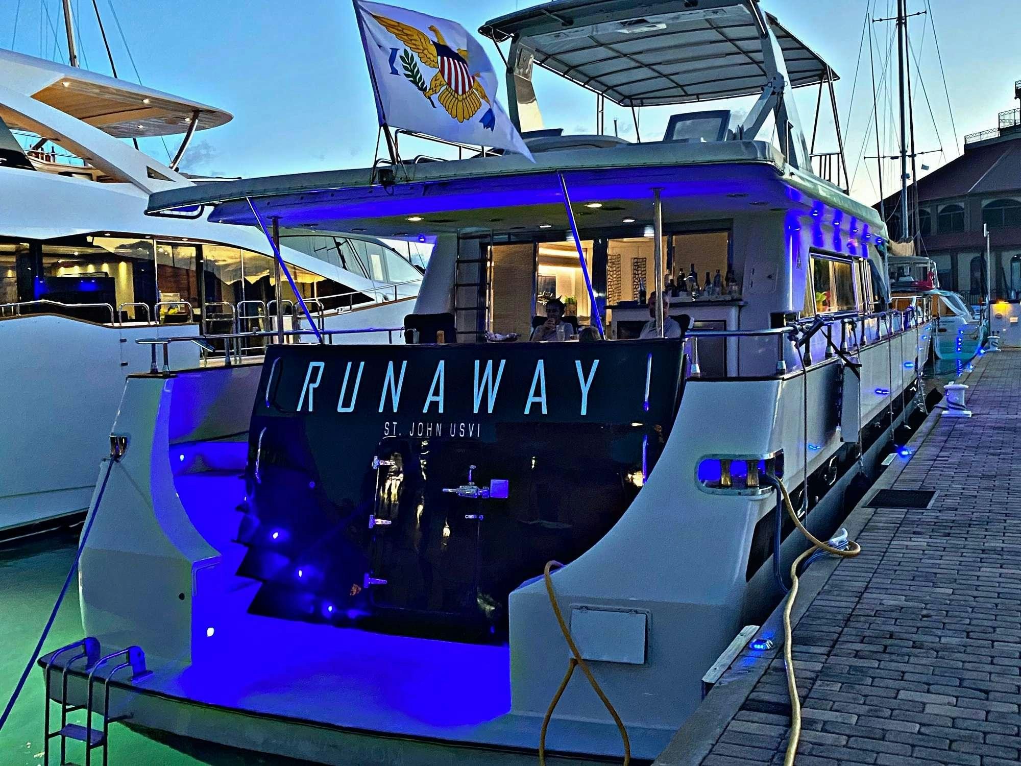 a boat with a sign on the front aboard RUNAWAY OF TORTOLA Yacht for Charter
