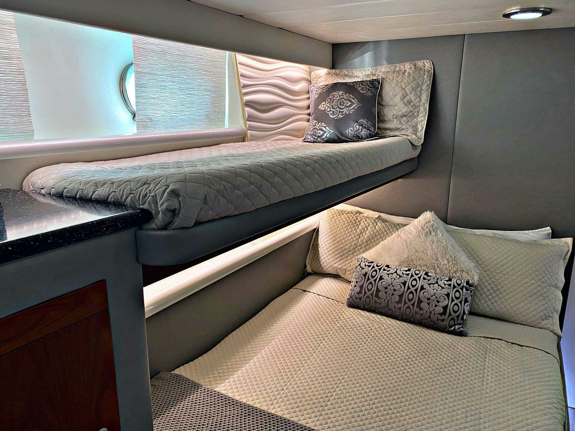 a bed with pillows aboard RUNAWAY OF TORTOLA Yacht for Charter