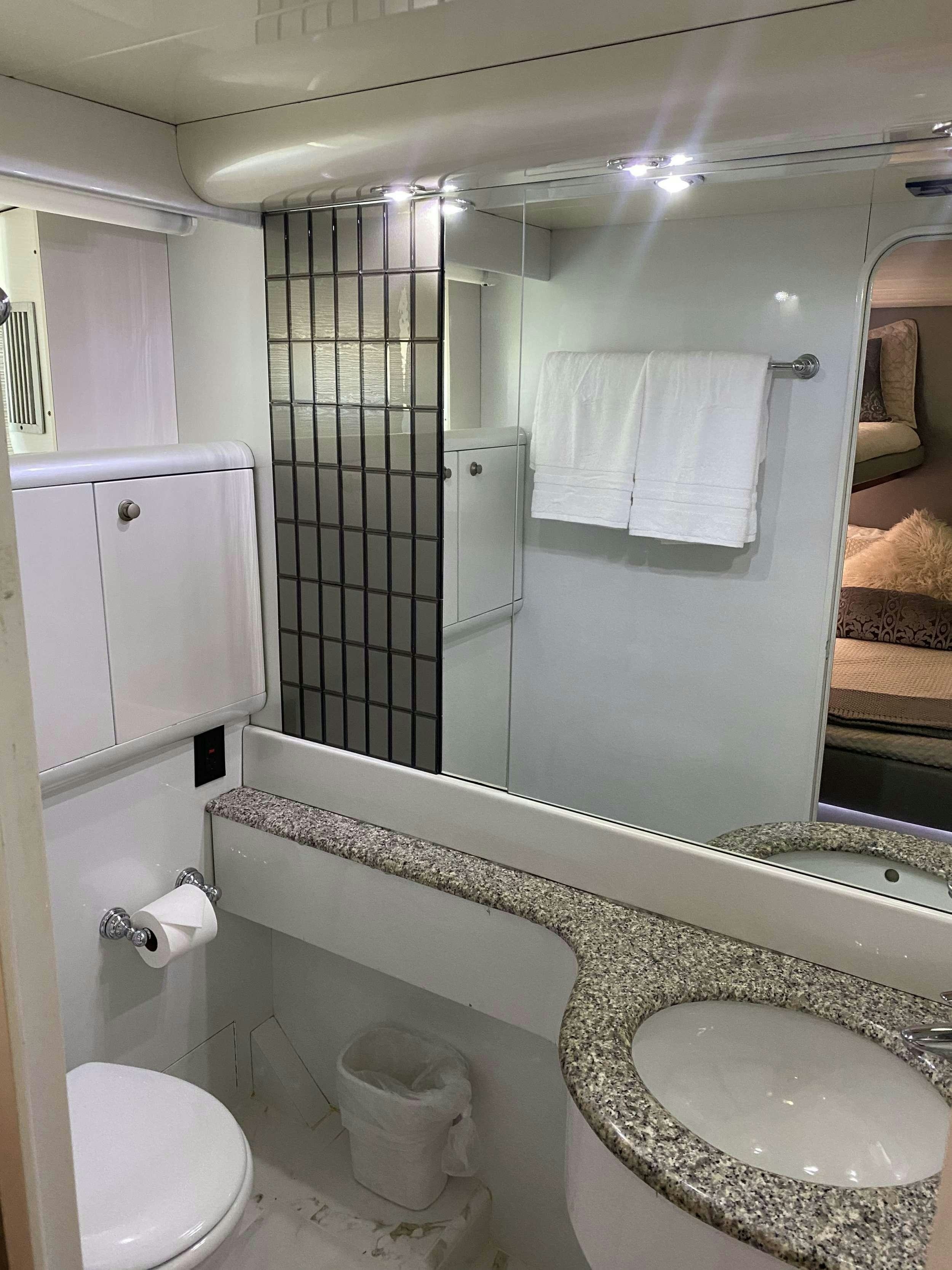 a bathroom with a glass shower aboard RUNAWAY OF TORTOLA Yacht for Charter