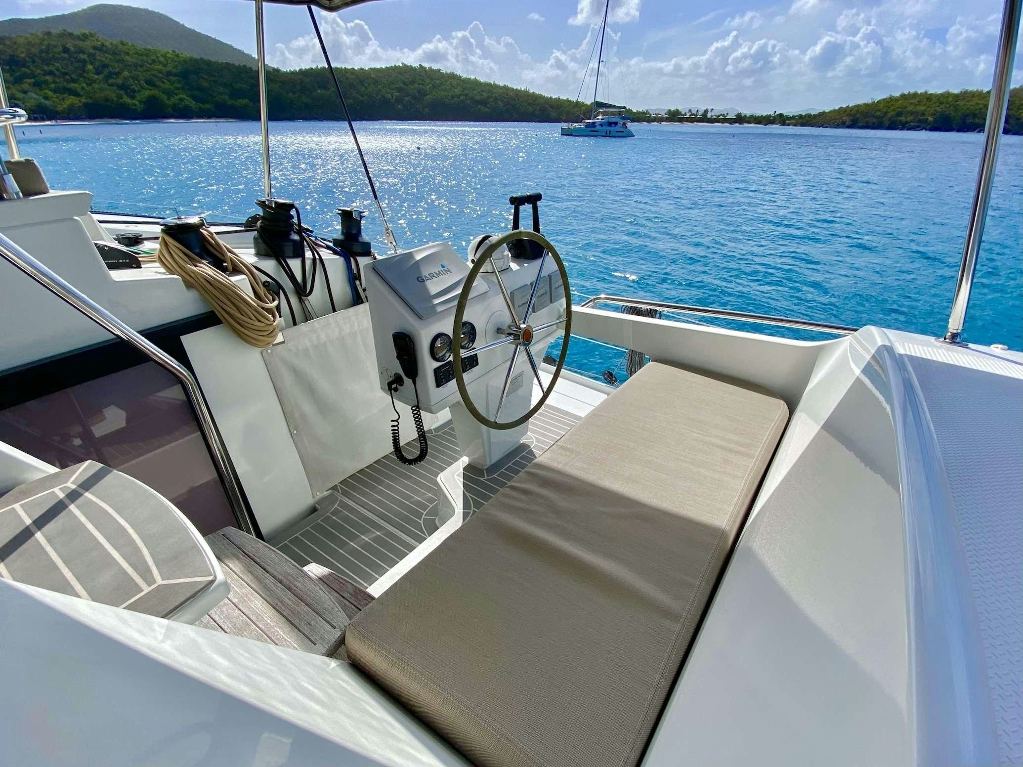 a boat with a steering wheel aboard OCEANFRONT PROPERTY Yacht for Charter