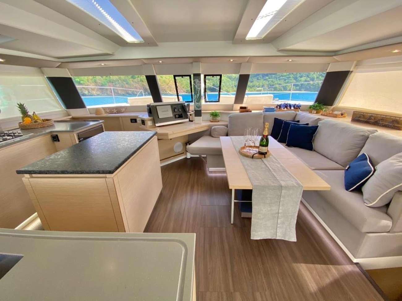 a room with a couch and a table aboard OCEANFRONT PROPERTY Yacht for Charter