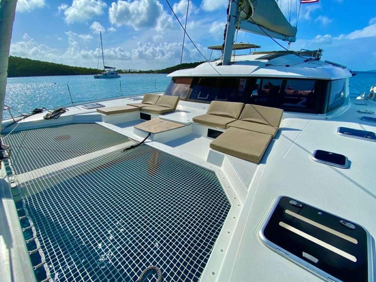 a boat on the water aboard OCEANFRONT PROPERTY Yacht for Charter
