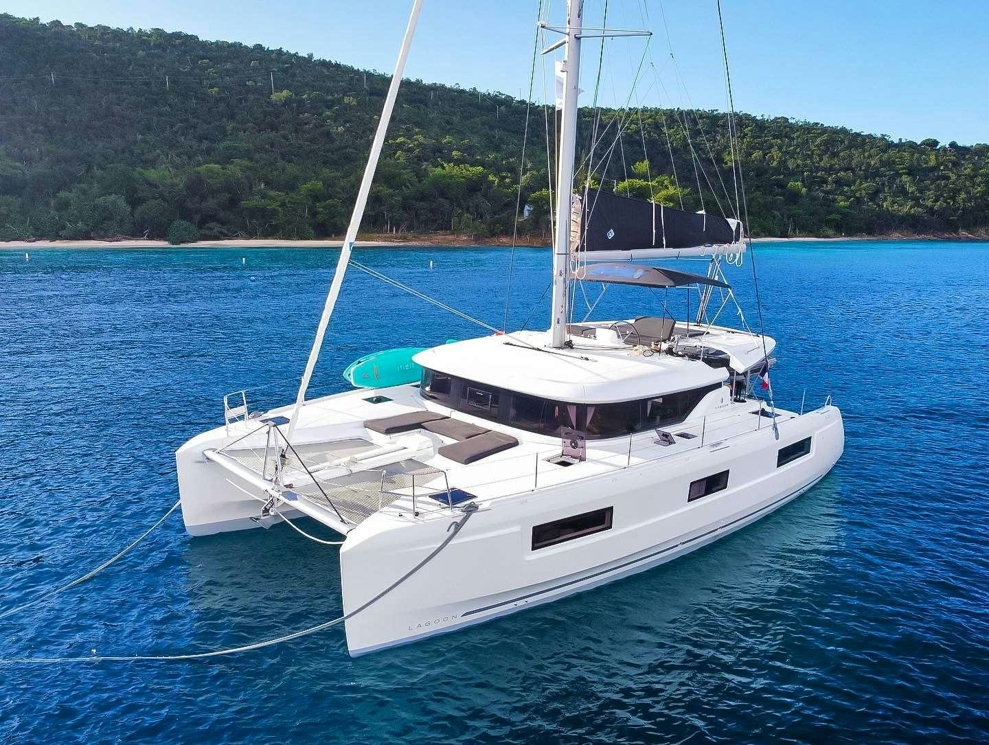 a white boat on the water aboard RENDEZ-VOUS Yacht for Charter