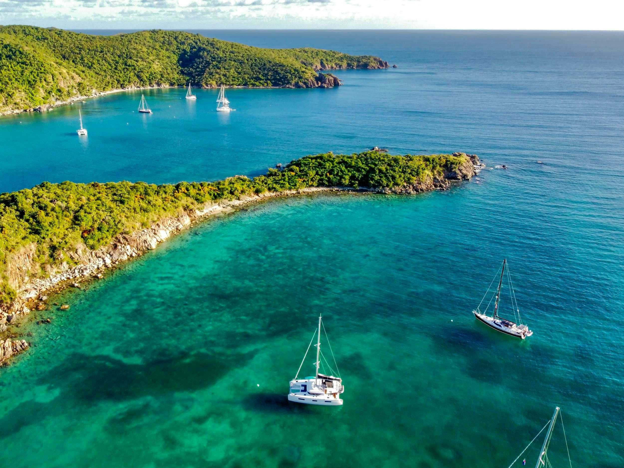 a group of boats in the water aboard RENDEZ-VOUS Yacht for Charter