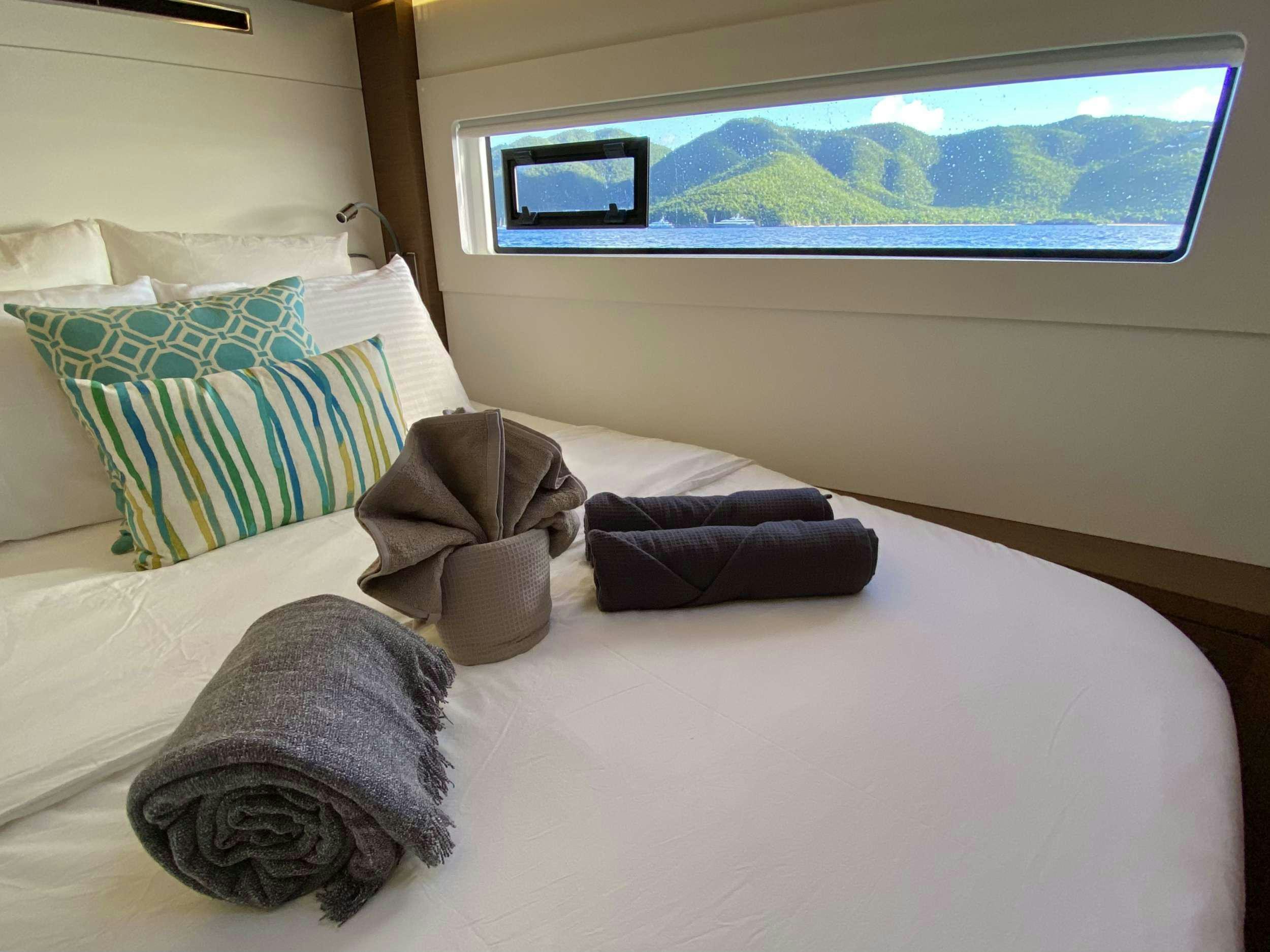 pillows on a bed aboard RENDEZ-VOUS Yacht for Charter