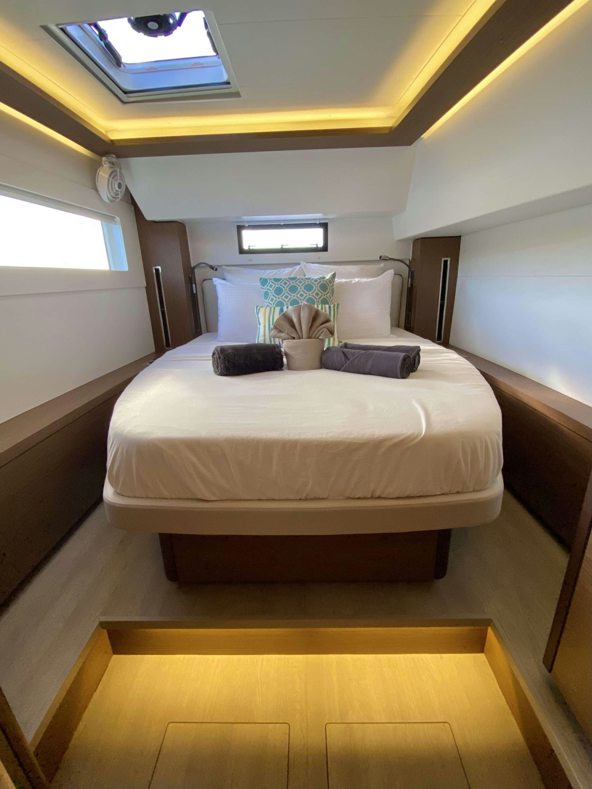 a bed in a room aboard RENDEZ-VOUS Yacht for Charter