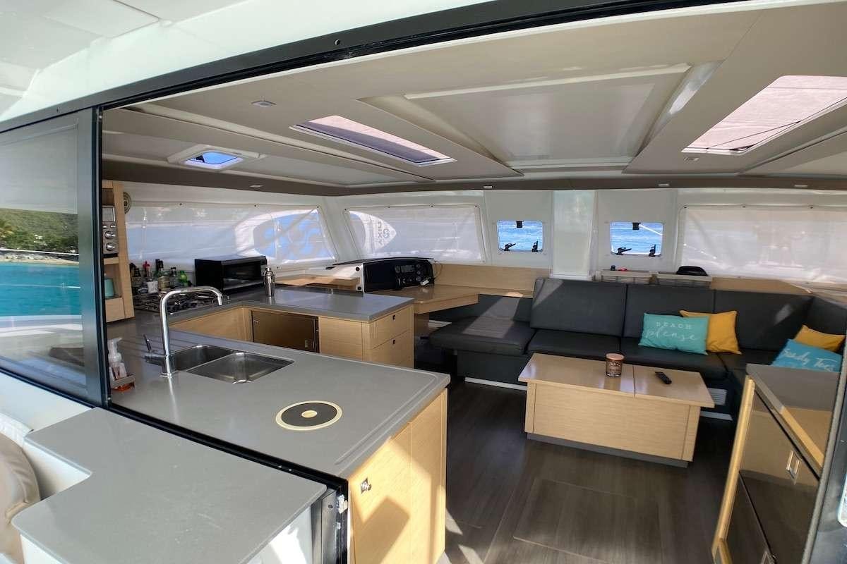 an empty office with a large window aboard IREMIA Yacht for Charter