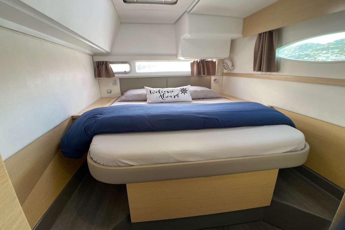 a bed in a room aboard IREMIA Yacht for Charter