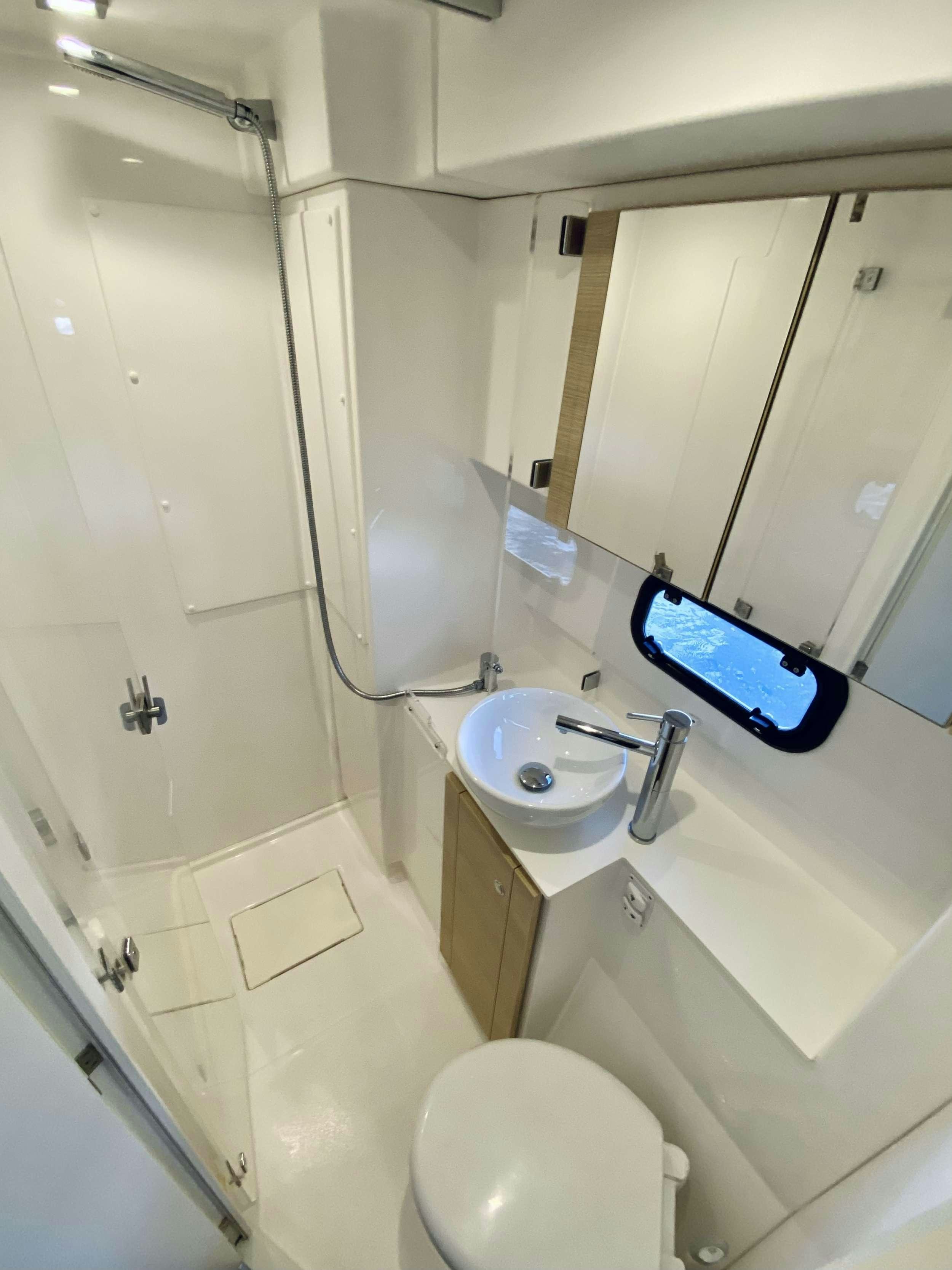 a bathroom with a phone on the counter aboard FREESTYLE Yacht for Charter