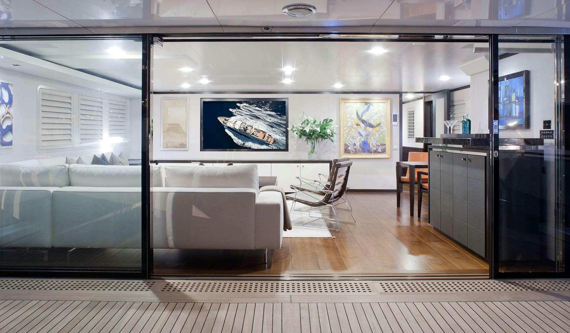 a room with a couch and a table aboard MIRAGE Yacht for Charter