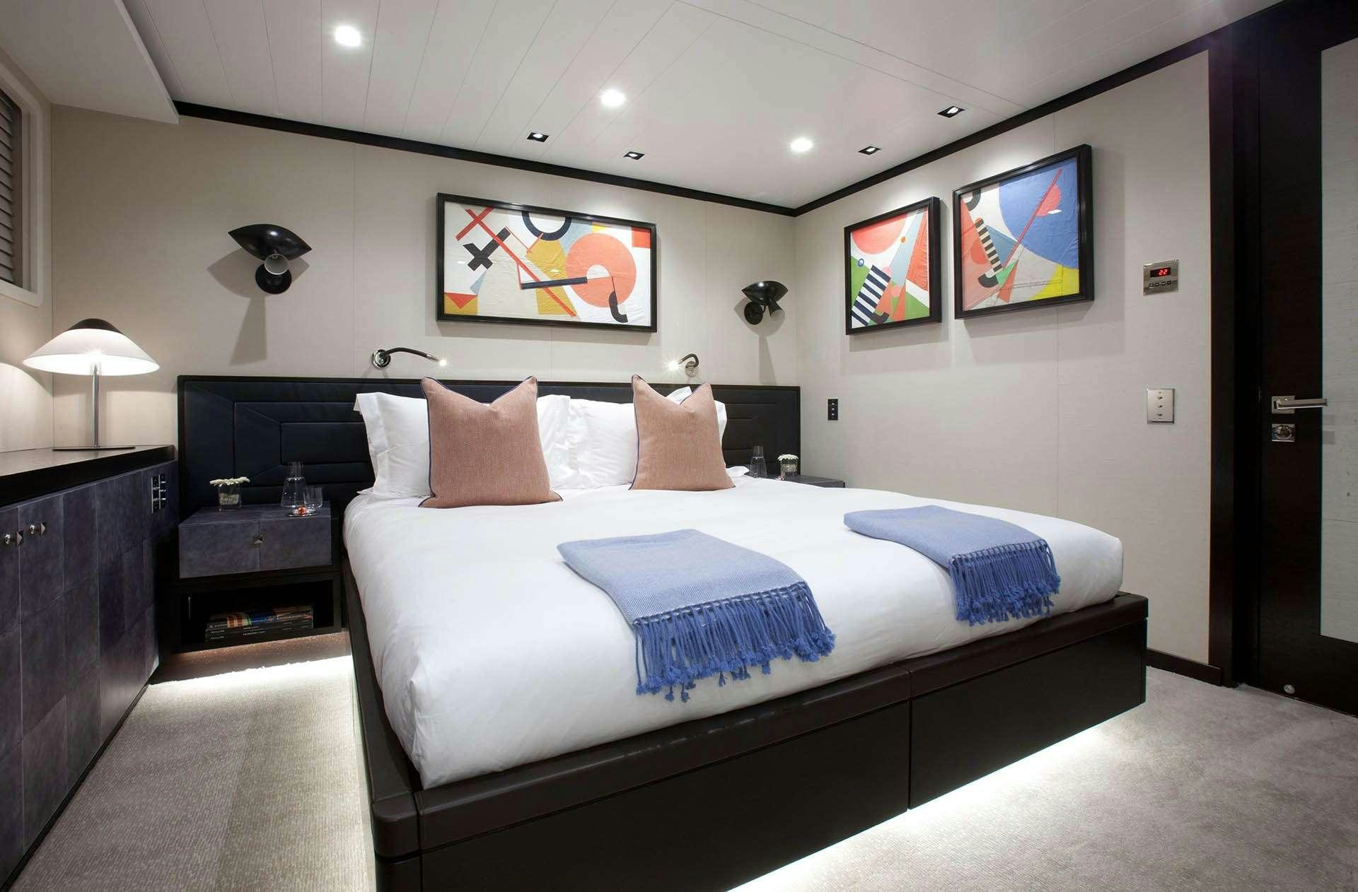 a bed in a hotel room aboard MIRAGE Yacht for Charter