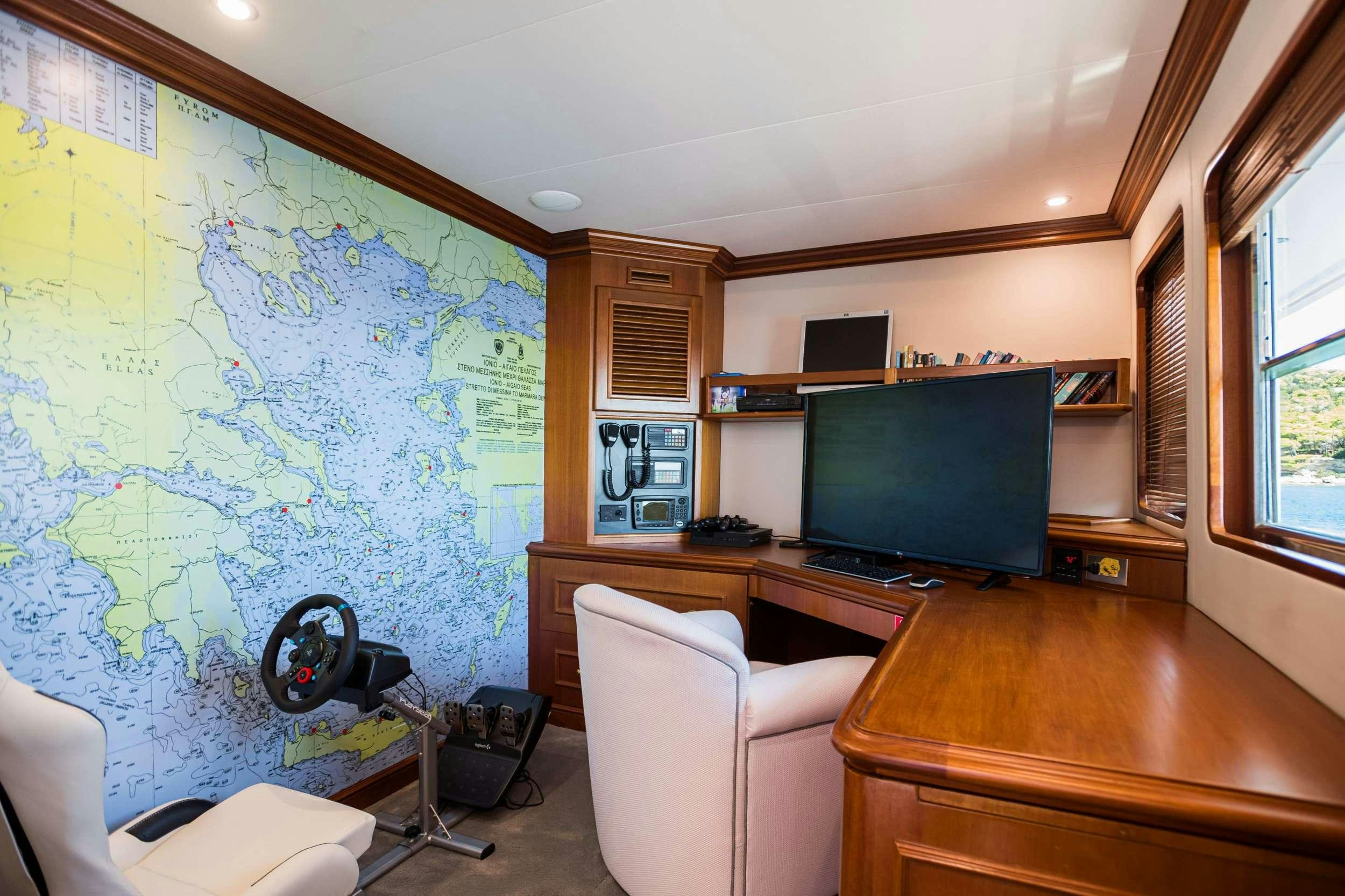 a room with a large screen aboard WIND OF FORTUNE Yacht for Charter