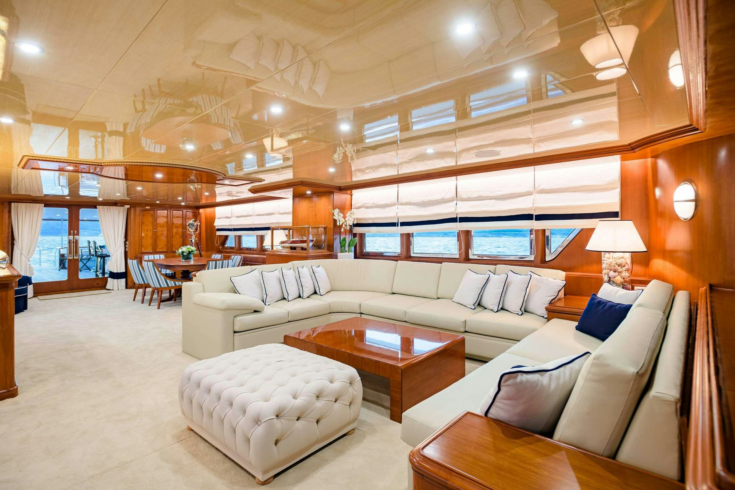 a living room with a large window aboard WIND OF FORTUNE Yacht for Charter
