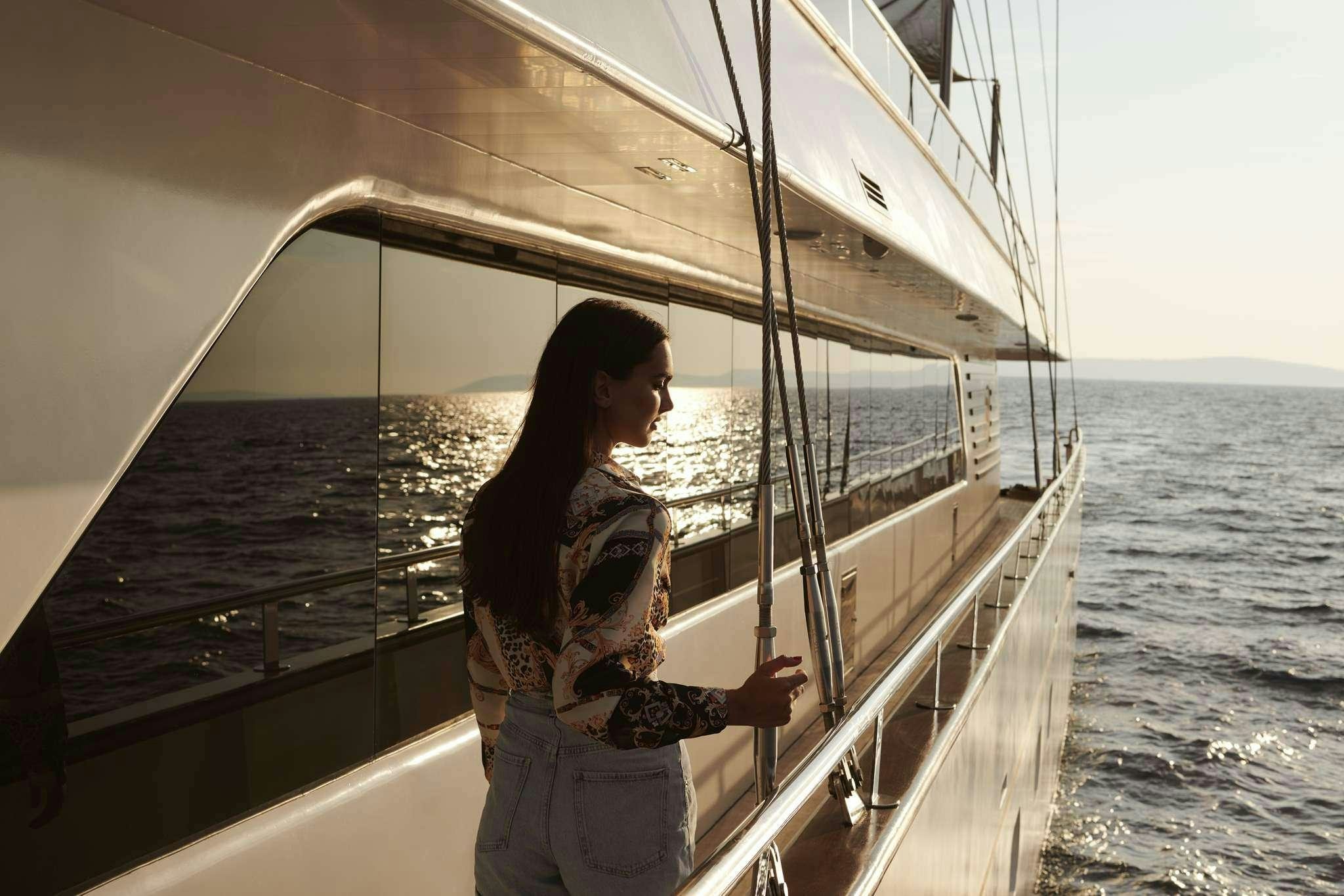 a person standing on a boat aboard ANIMA MARIS Yacht for Charter
