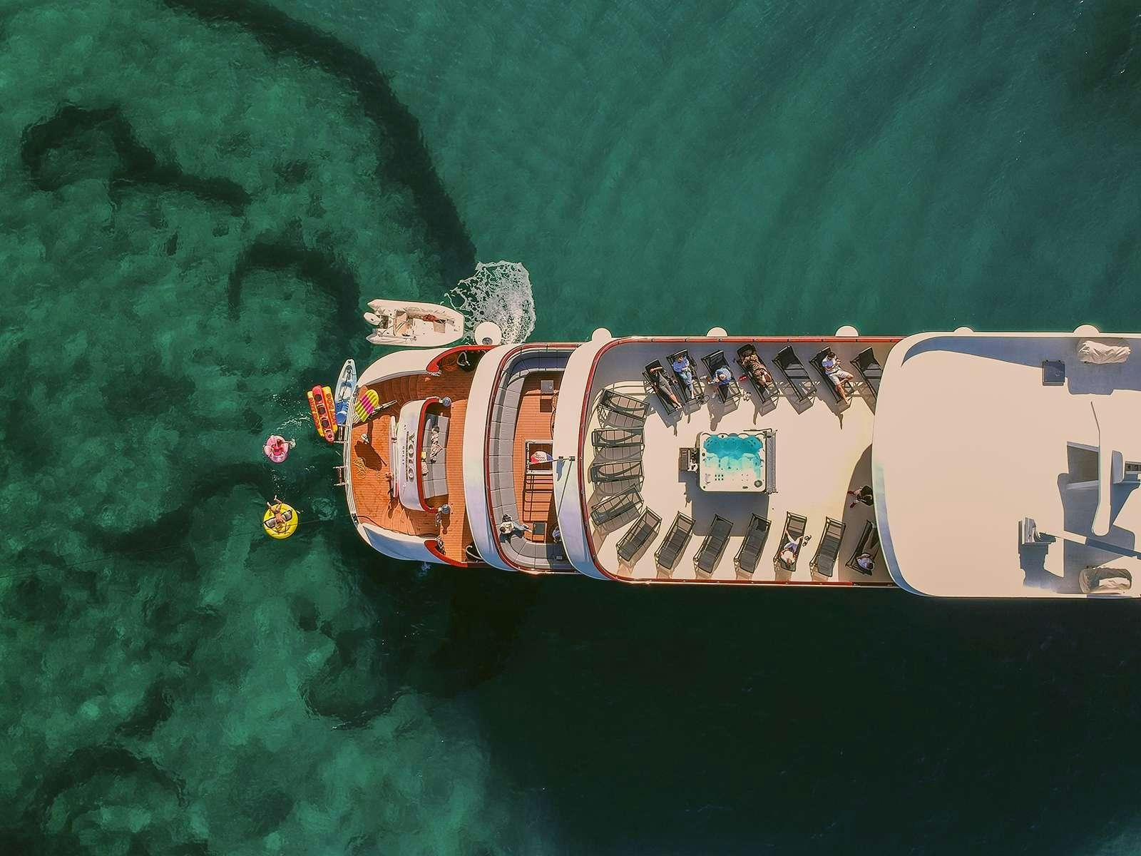a satellite in the water aboard YOLO Yacht for Charter
