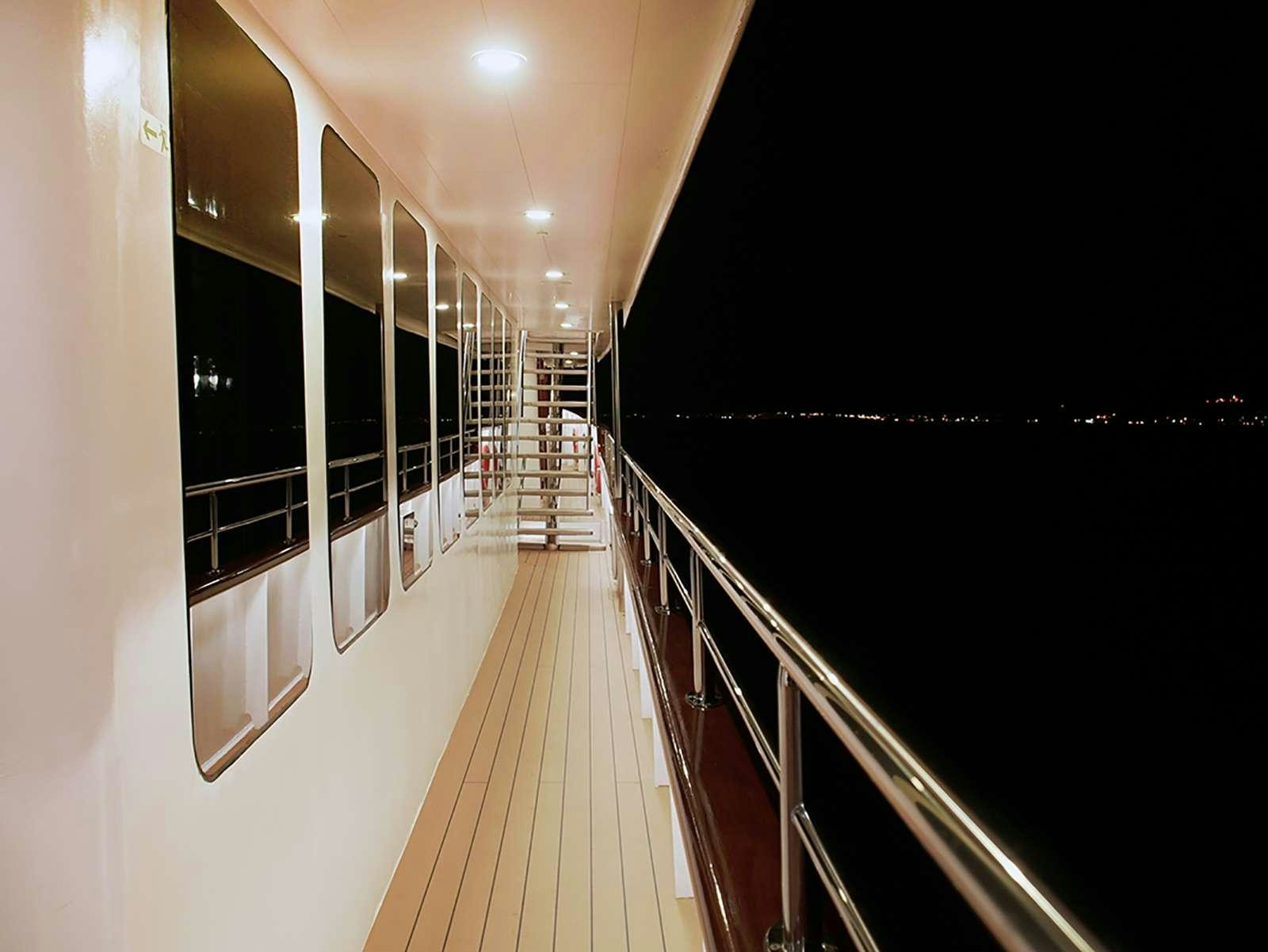 a long hallway with several doors aboard YOLO Yacht for Charter