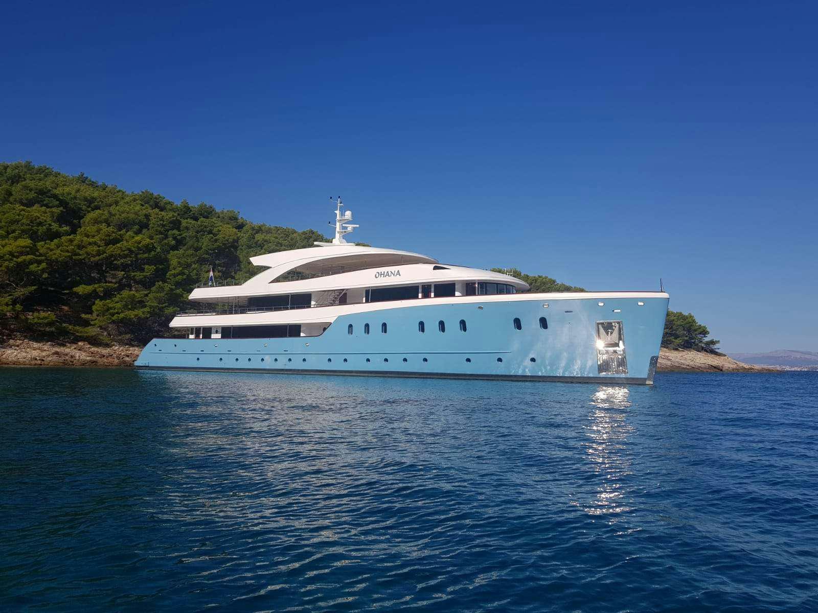 a white boat in the water aboard OHANA Yacht for Charter