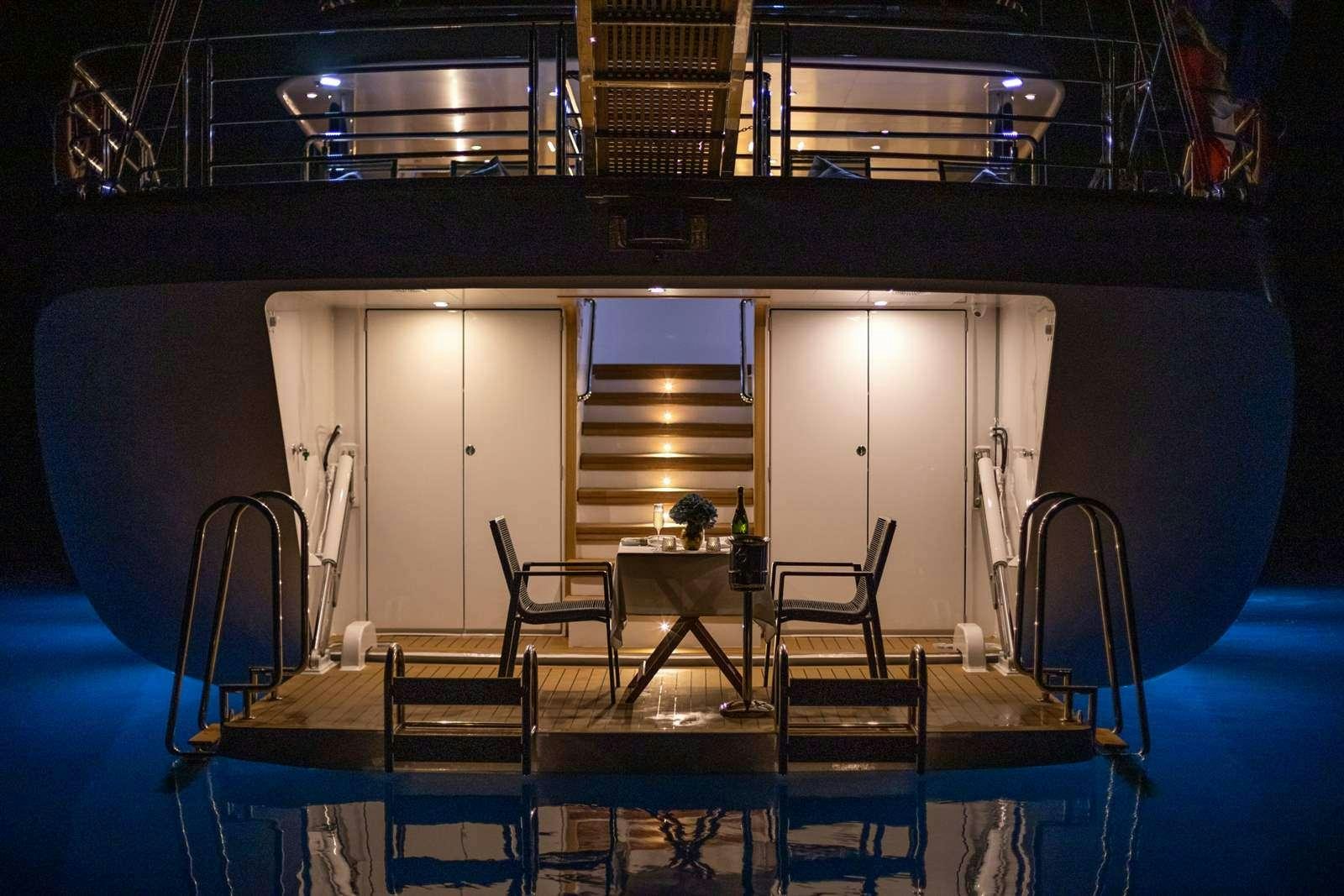 a room with a table and chairs aboard LOVE STORY Yacht for Charter