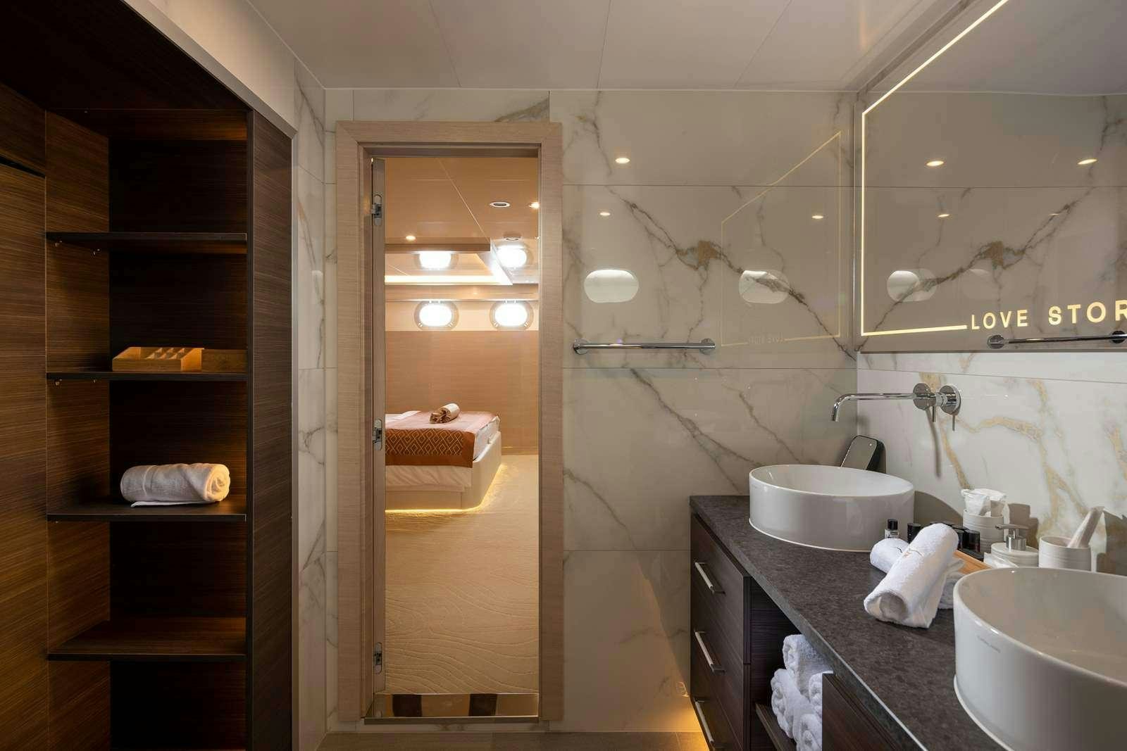 a bathroom with a sink and a mirror aboard LOVE STORY Yacht for Charter