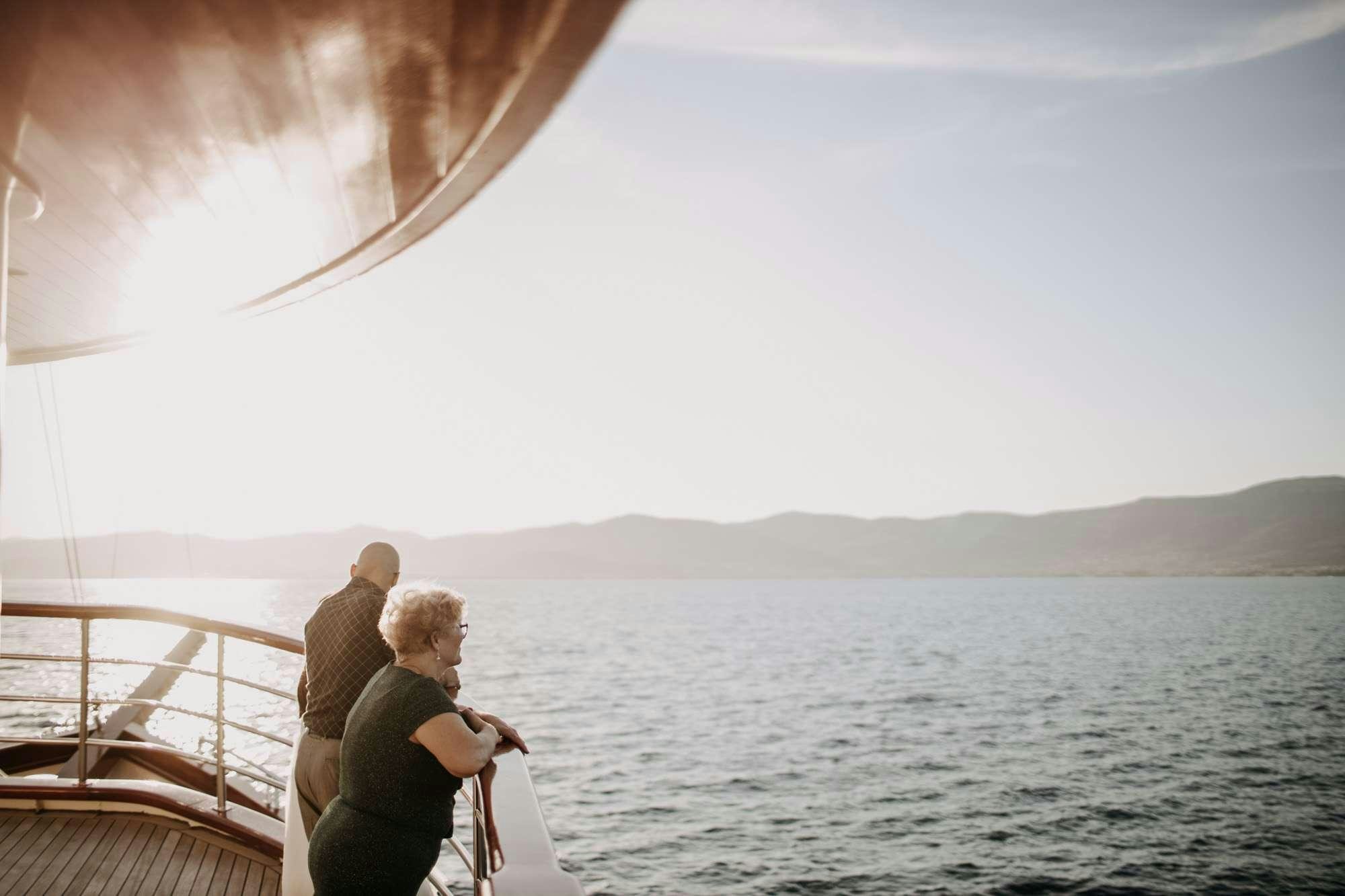 a couple of people on a boat looking at the water aboard ALMISSA Yacht for Charter