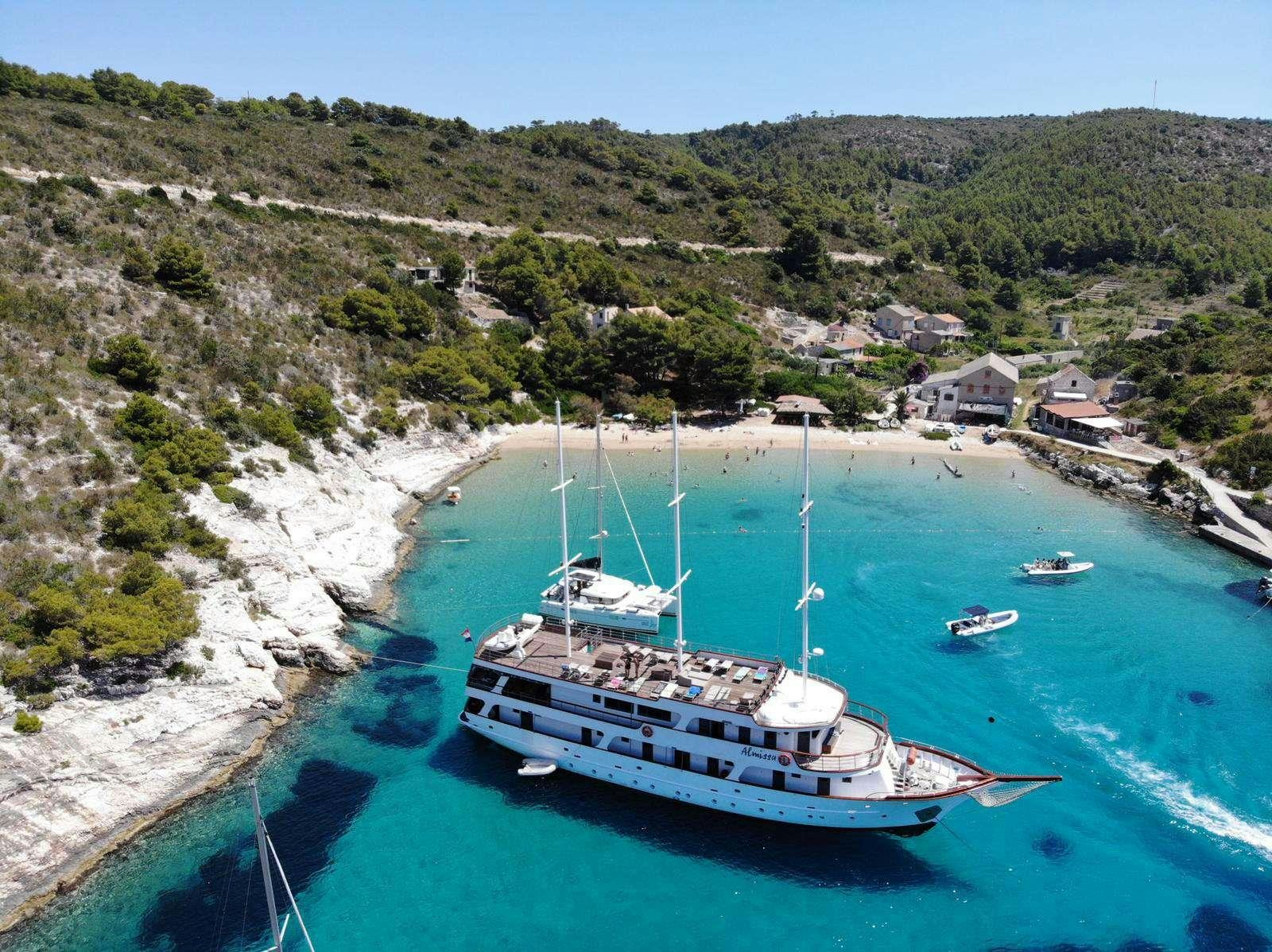 a boat sailing on a river aboard ALMISSA Yacht for Charter