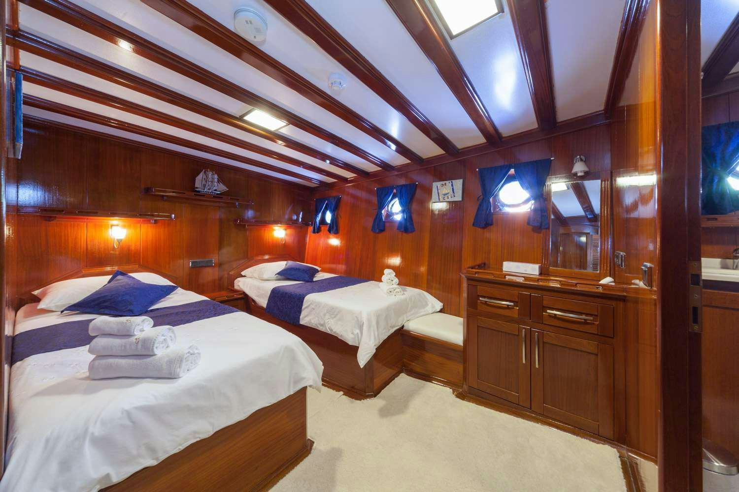 a room with two beds aboard STELLA MARIS Yacht for Charter