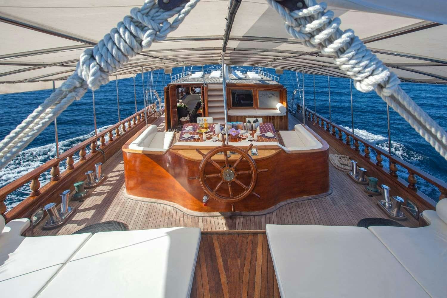 a boat on a water body aboard STELLA MARIS Yacht for Charter