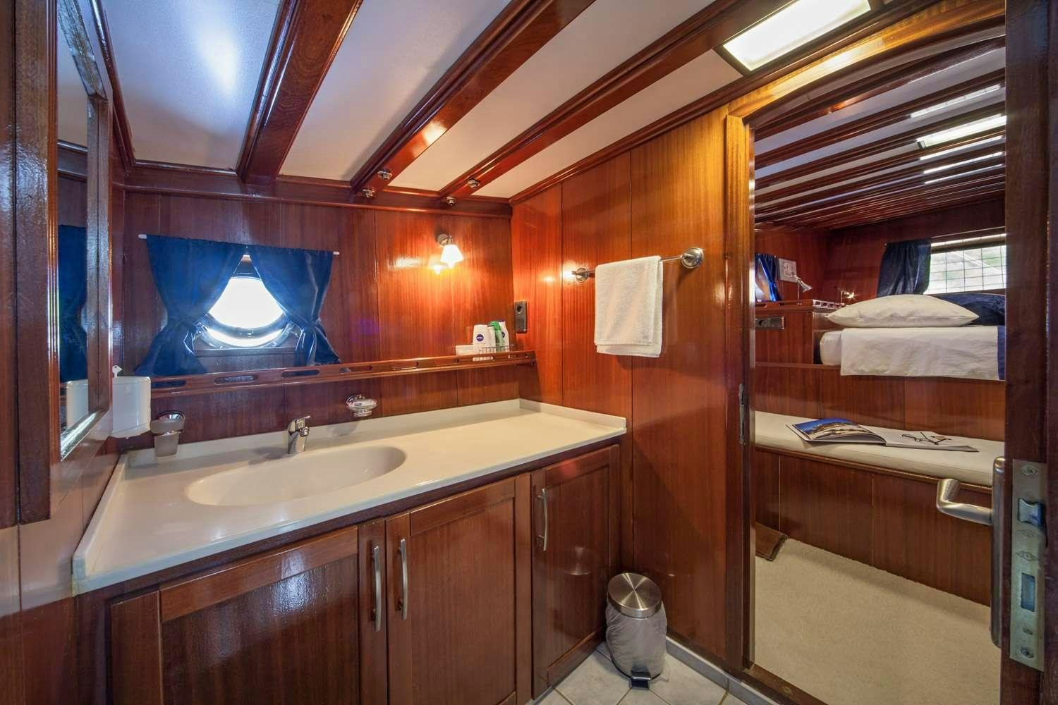 a bathroom with a large mirror aboard STELLA MARIS Yacht for Charter