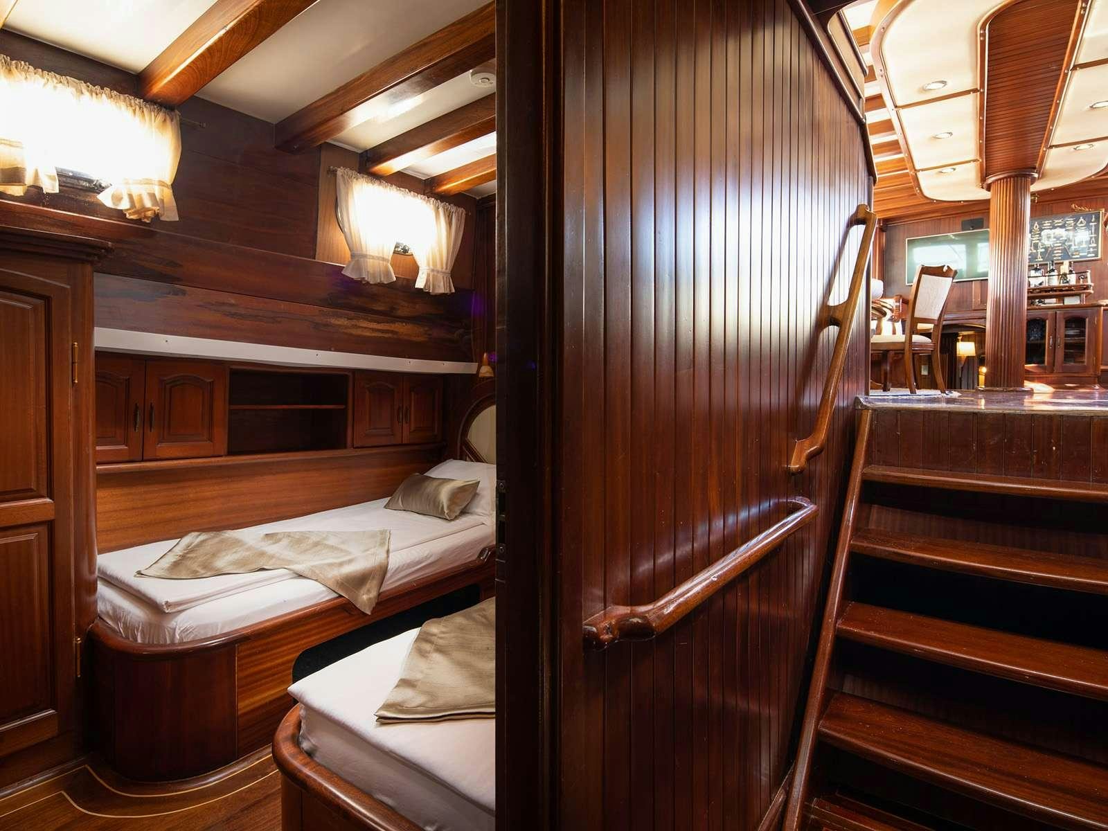 a room with a bed and a door aboard GULET NOSTRA VITA Yacht for Charter