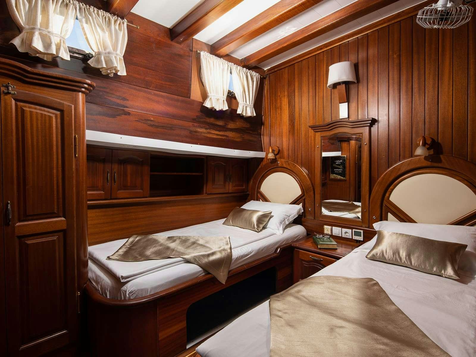 a couple of beds in a room aboard GULET NOSTRA VITA Yacht for Charter