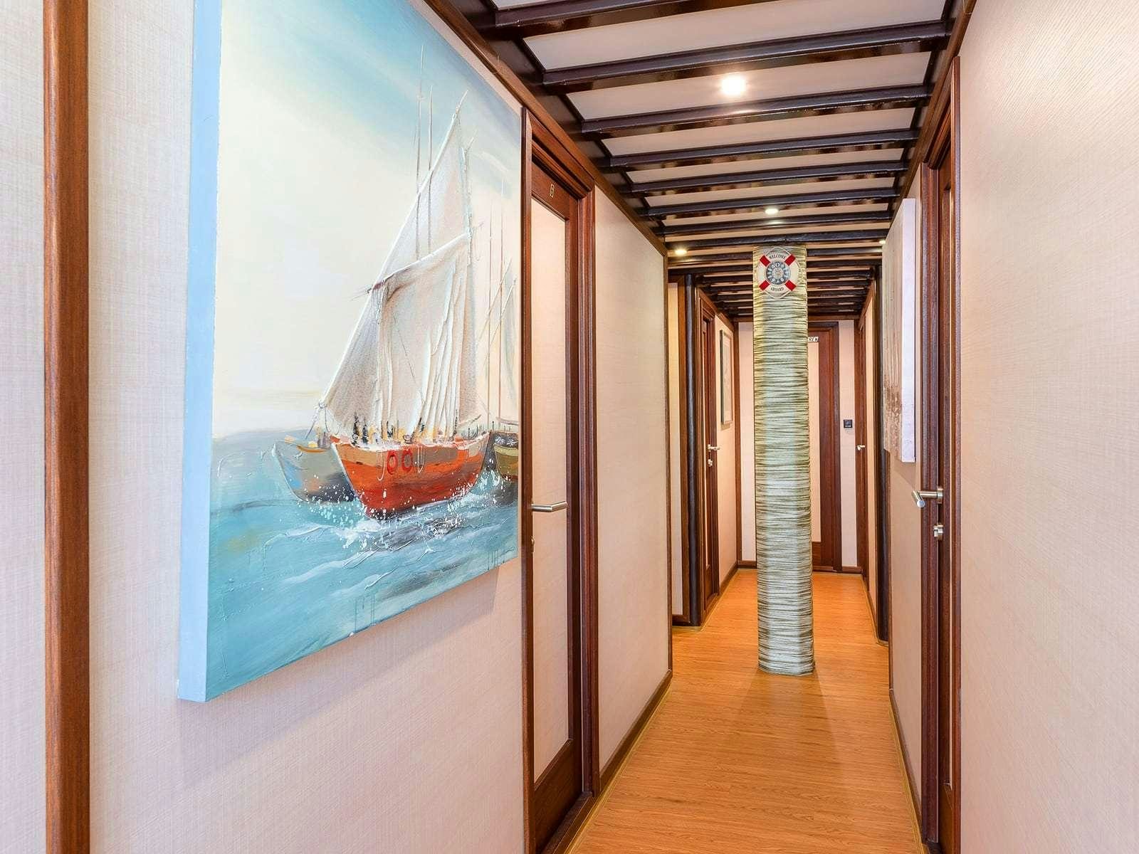 a hallway with a glass window aboard Gulet Nautilus Yacht for Charter