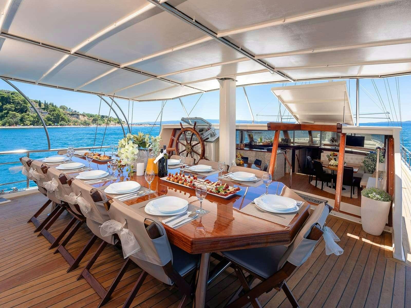 a table set for a dinner aboard Gulet Nautilus Yacht for Charter