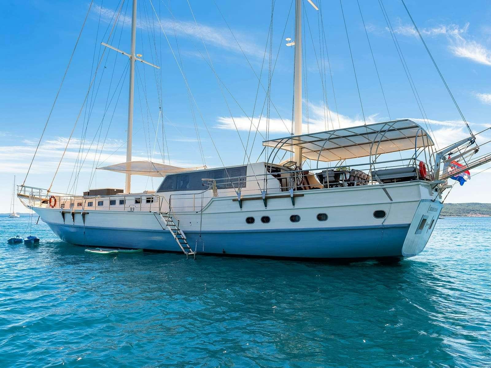 a large white boat in the water aboard Gulet Nautilus Yacht for Charter