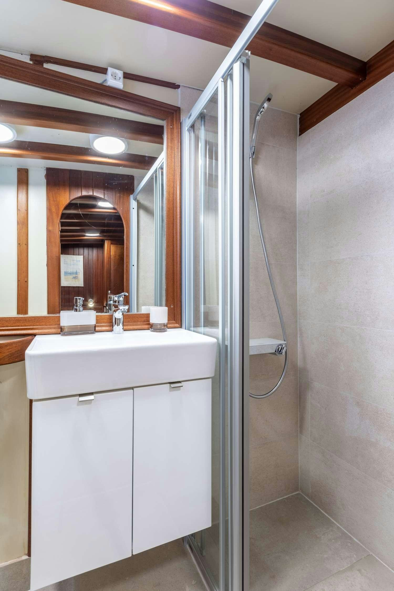 a shower unit in a bathroom aboard ANGELICA Yacht for Charter