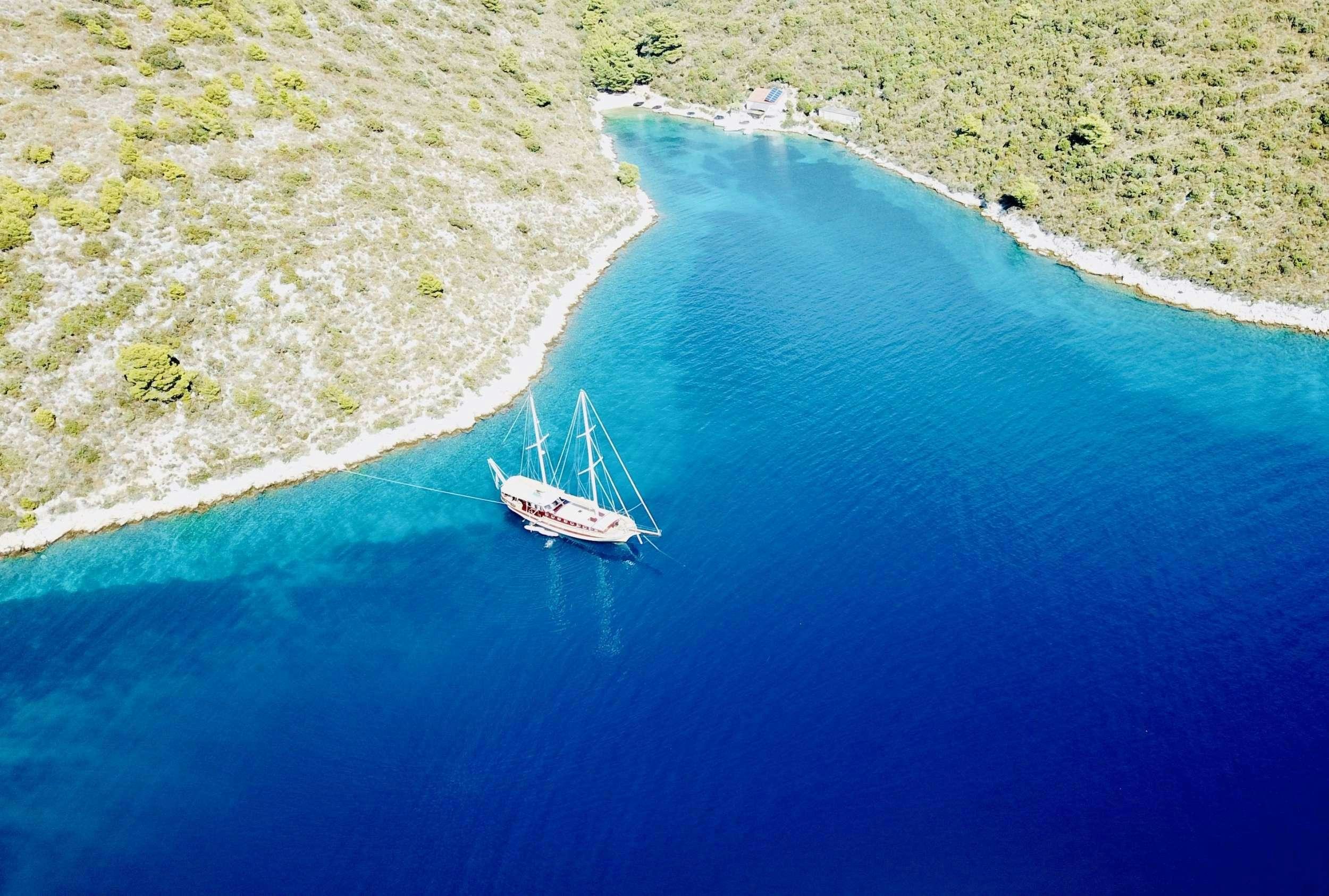 a boat sailing on the water aboard ANGELICA Yacht for Charter