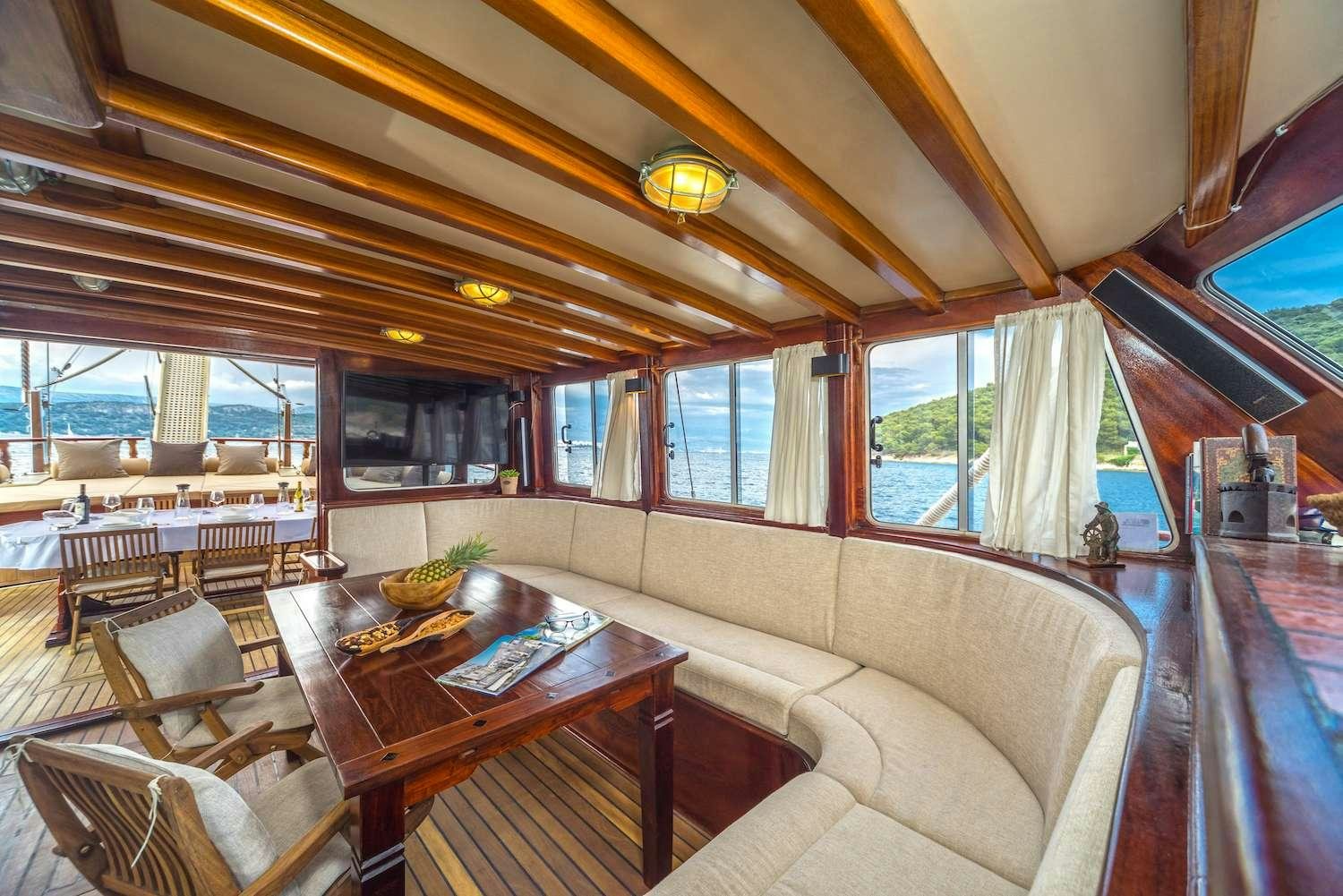 a boat with a table and chairs aboard ANGELICA Yacht for Charter