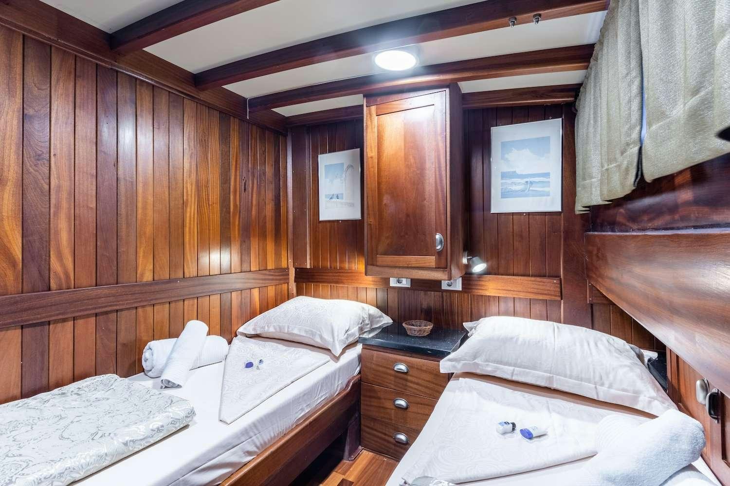 a couple of beds in a cabin aboard ANGELICA Yacht for Charter
