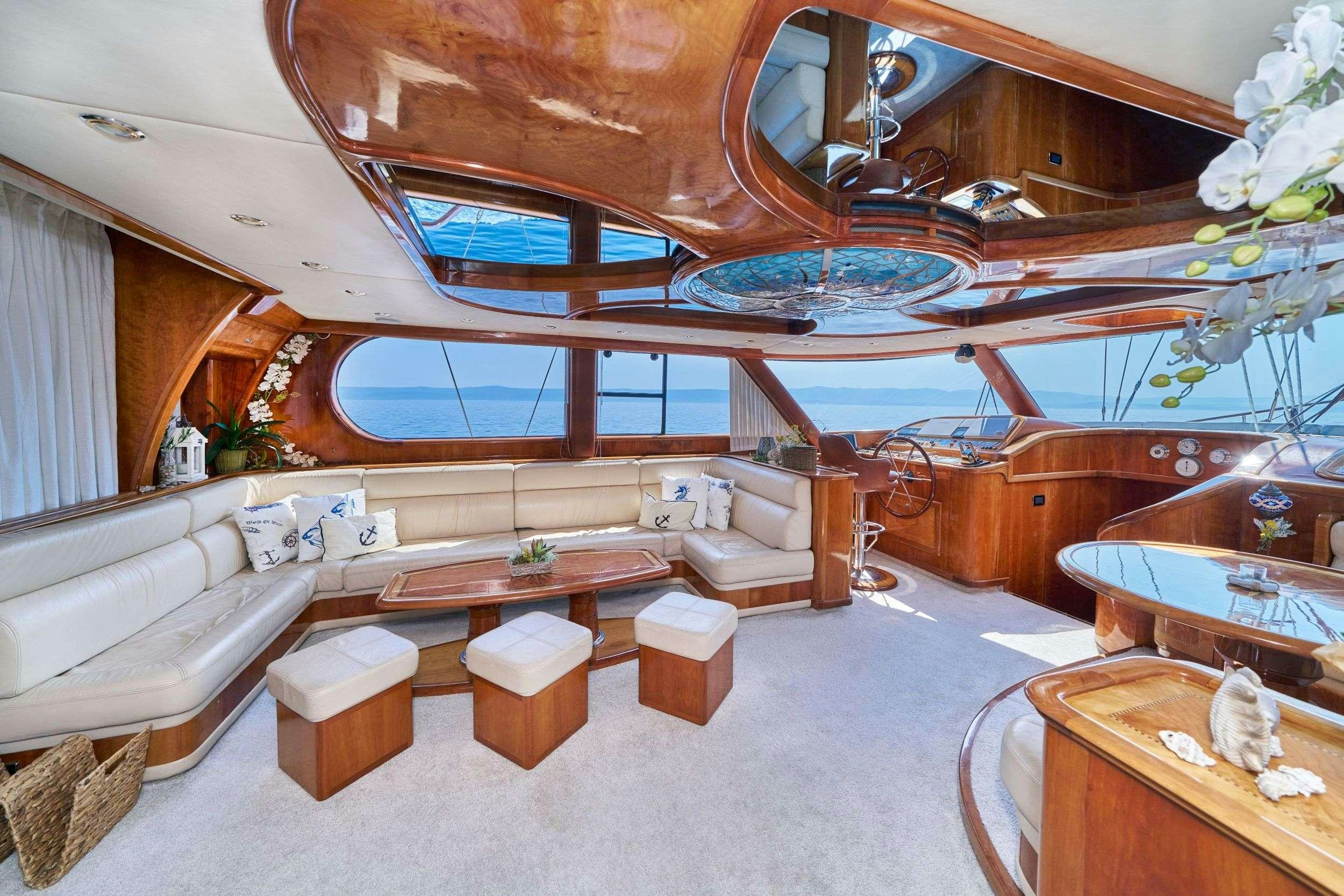a room with a bed and a table aboard LOTUS Yacht for Charter