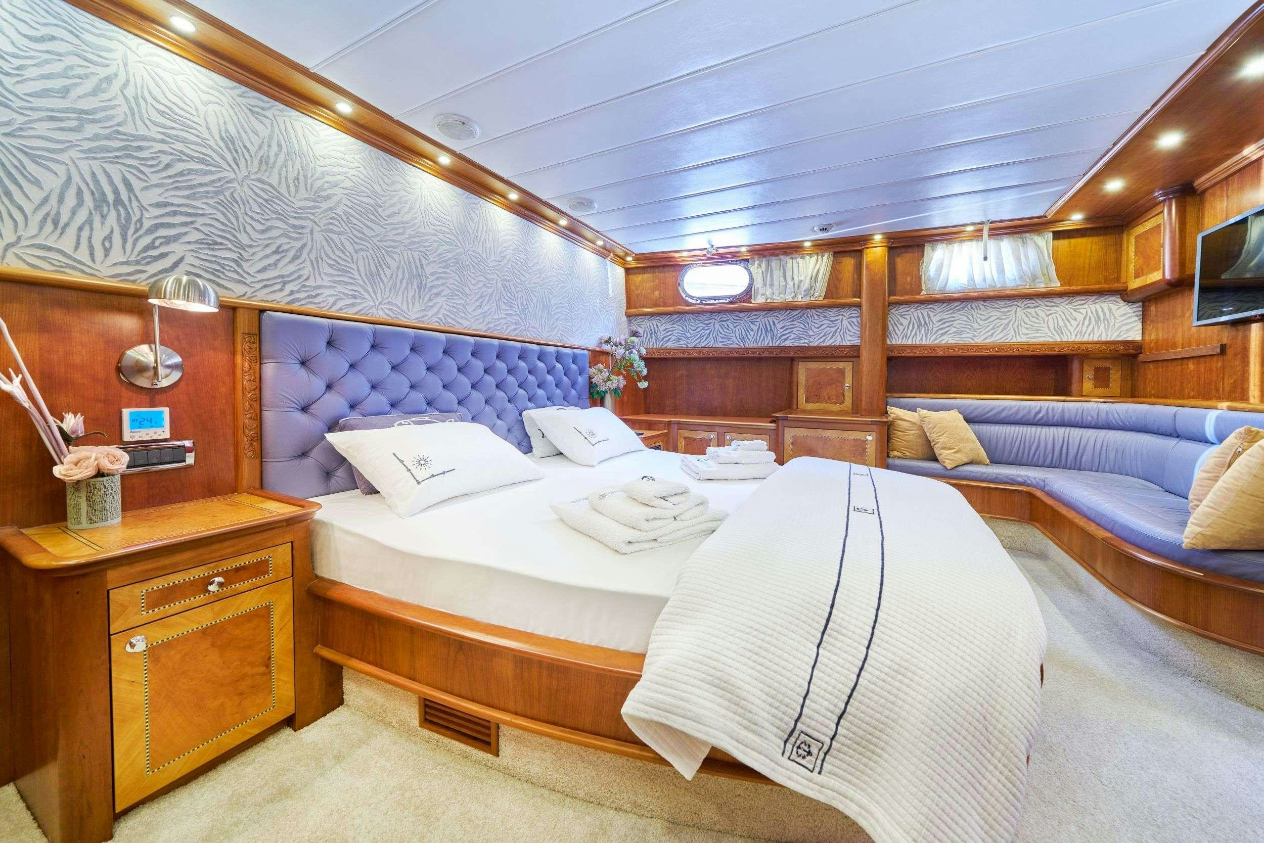 a room with two beds aboard LOTUS Yacht for Charter