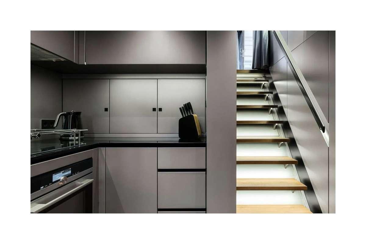 a kitchen with a white cupboard aboard 7X Yacht for Charter