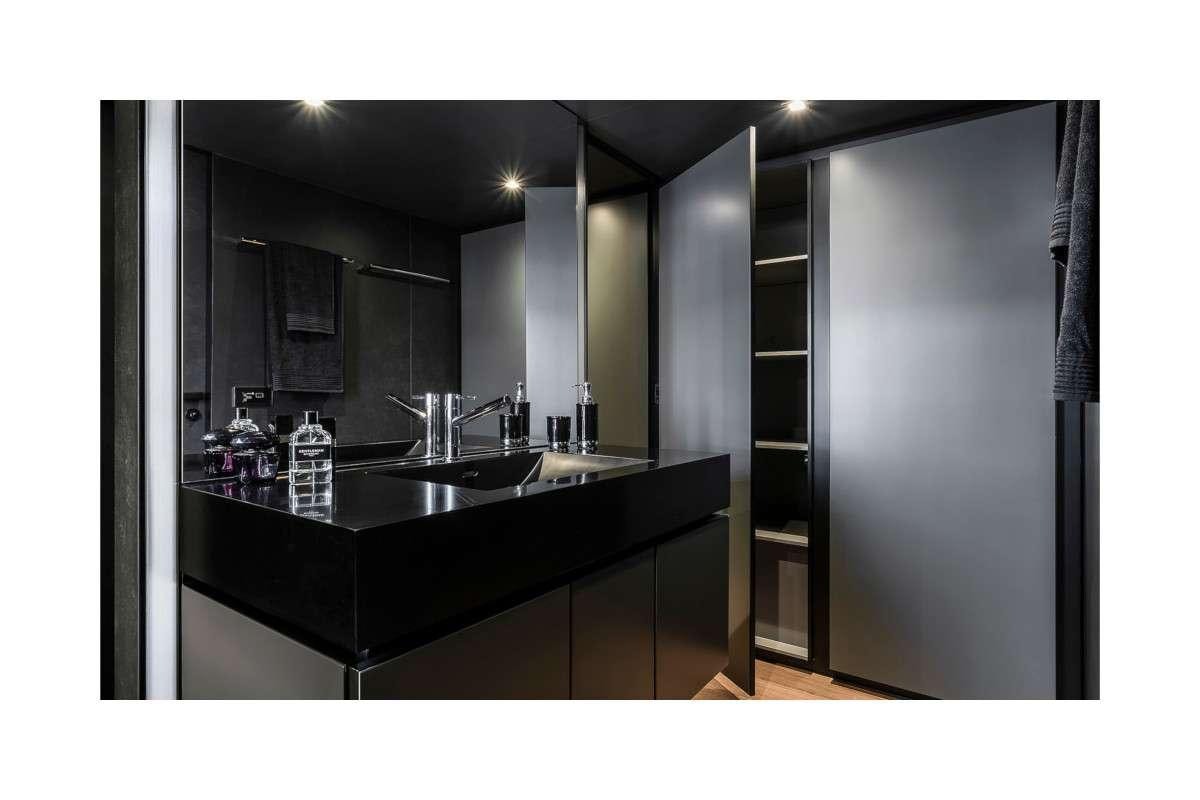 a bathroom with a sink and a mirror aboard 7X Yacht for Charter