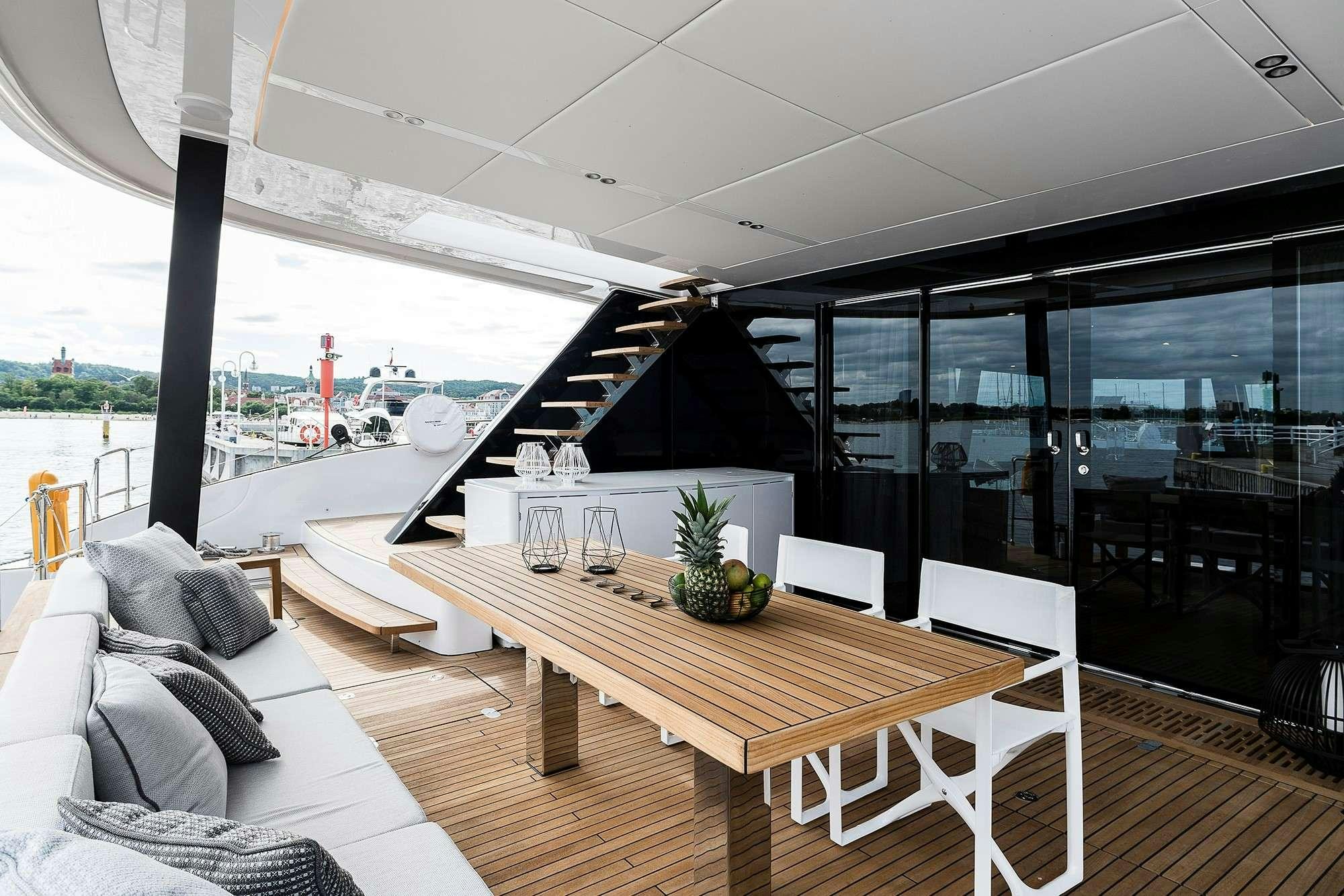 a room with a table and chairs aboard 7X Yacht for Charter