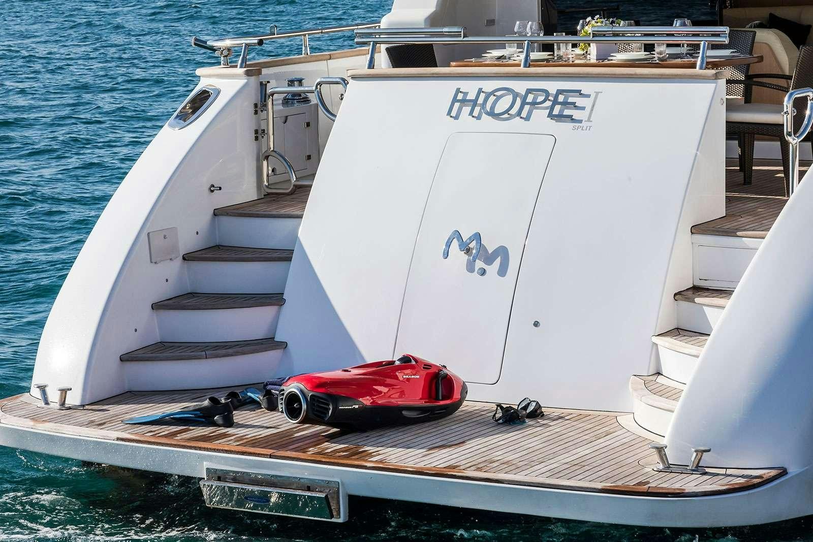a boat with a motor on the front aboard HOPE I Yacht for Charter