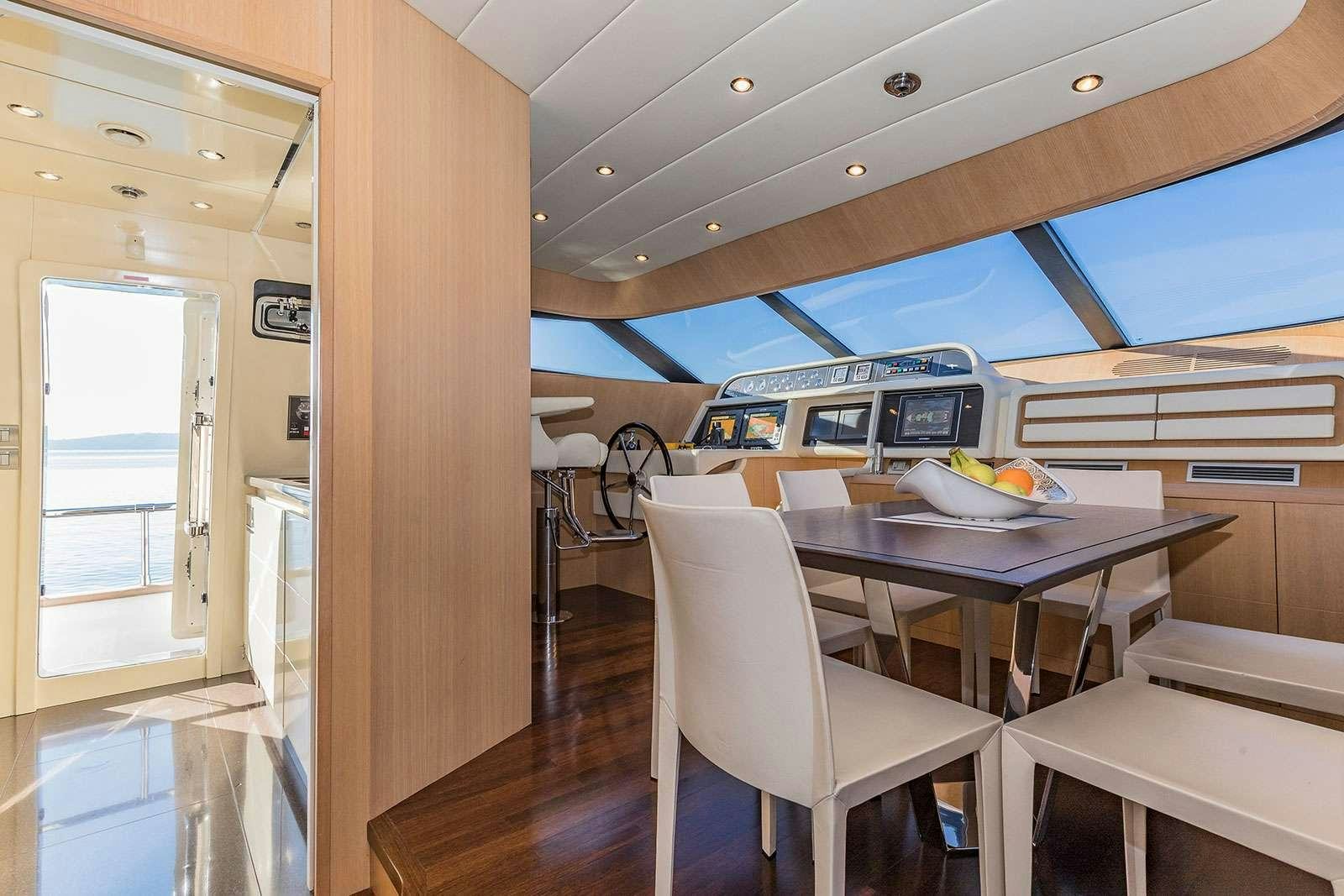 a room with a table and chairs aboard HOPE I Yacht for Charter