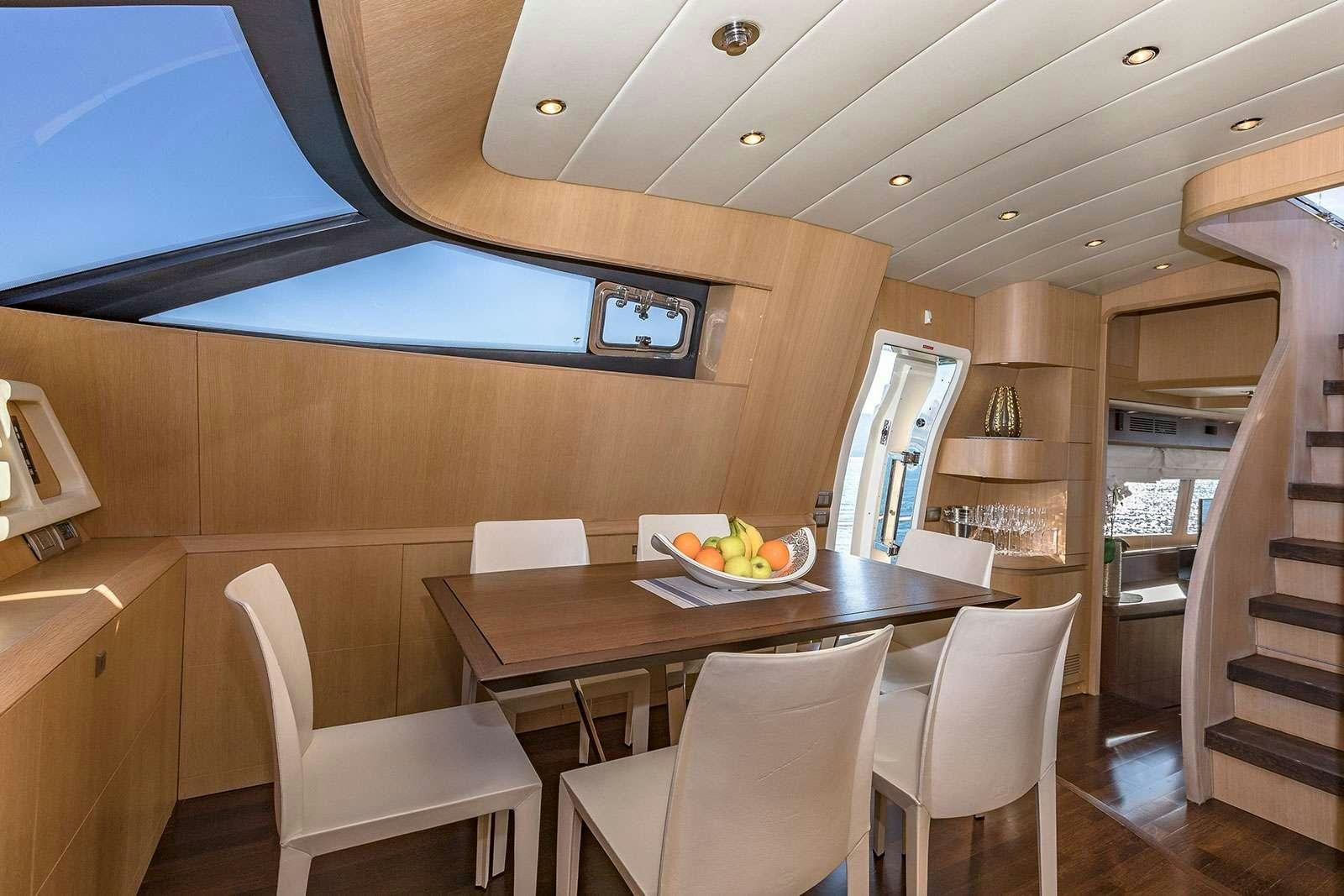 a dining table in a room aboard HOPE I Yacht for Charter