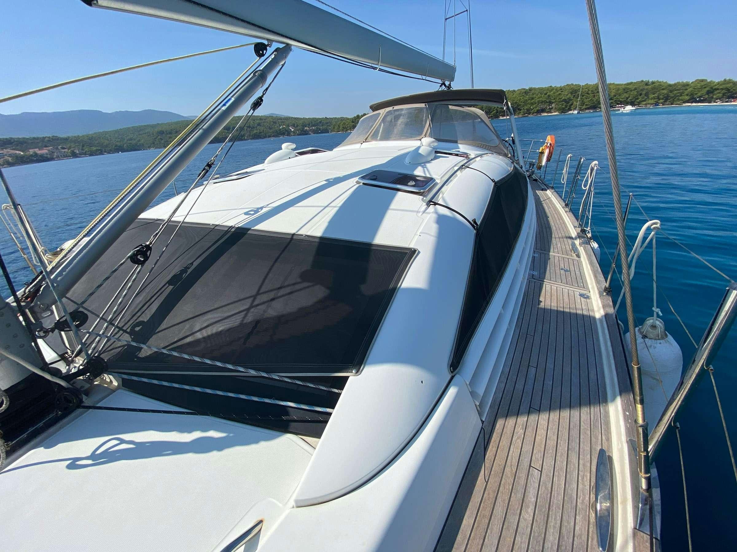 a boat on the water aboard ADIQELL (Pilot Saloon 55) Yacht for Charter