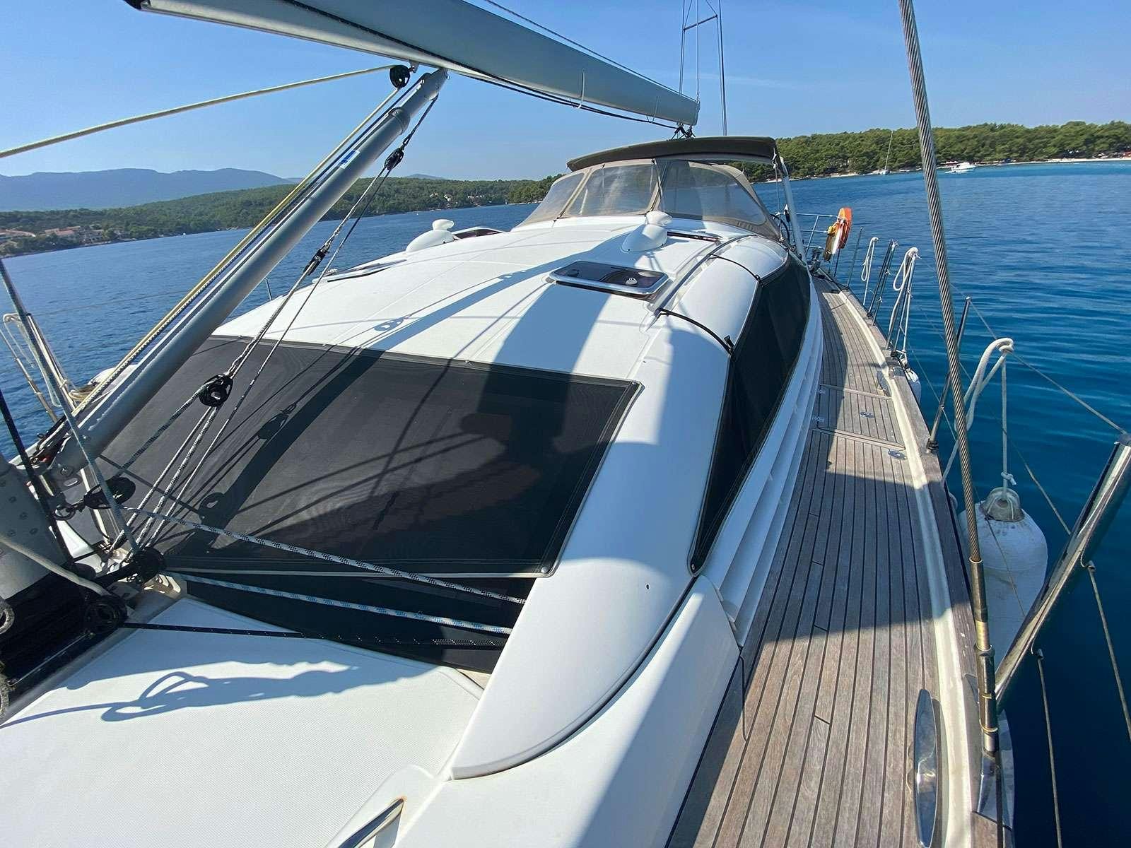 a boat on the water aboard ADIQELL (Pilot Saloon 55) Yacht for Charter